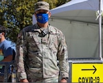Las Vegas National Guard Sgt. John Huss with Joint Task Force 17 works at the entry point at the Cashman COVID-19 vaccination site March 16, 2021, in Las Vegas. Huss helped his chain of command streamline the vaccine standby list.