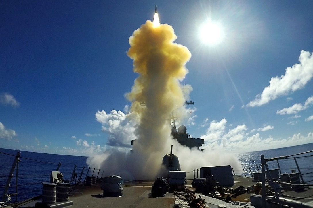 A missile is launched from a military ship.