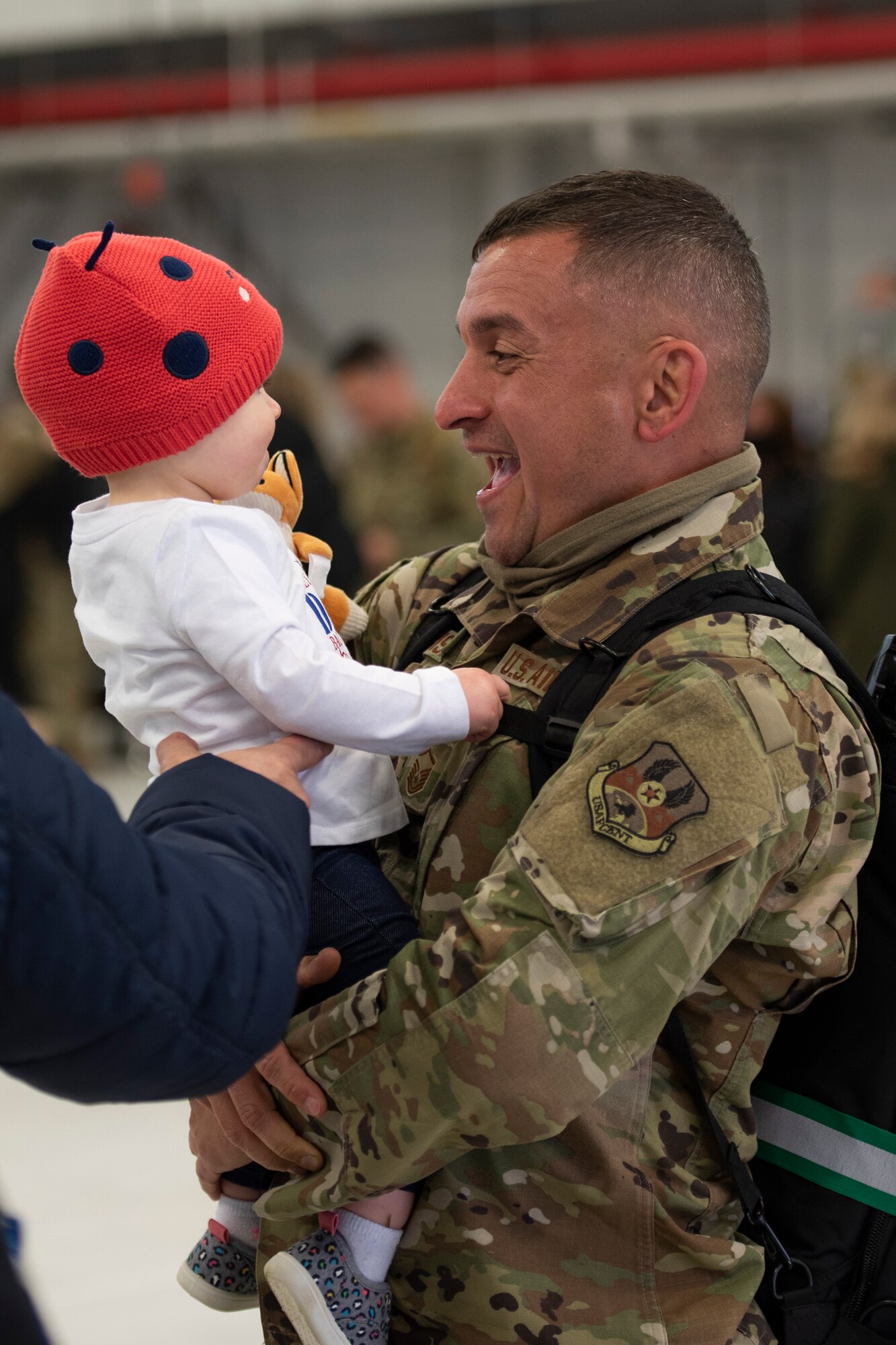 Master Sgt. David Harrison, a network systems operator, assigned to the Ohio National Guard’s 180th Fighter Wing, hold his daughter after returning home from their overseas deployment, Jan. 26, 2020 at the 180FW in Swanton, Ohio.