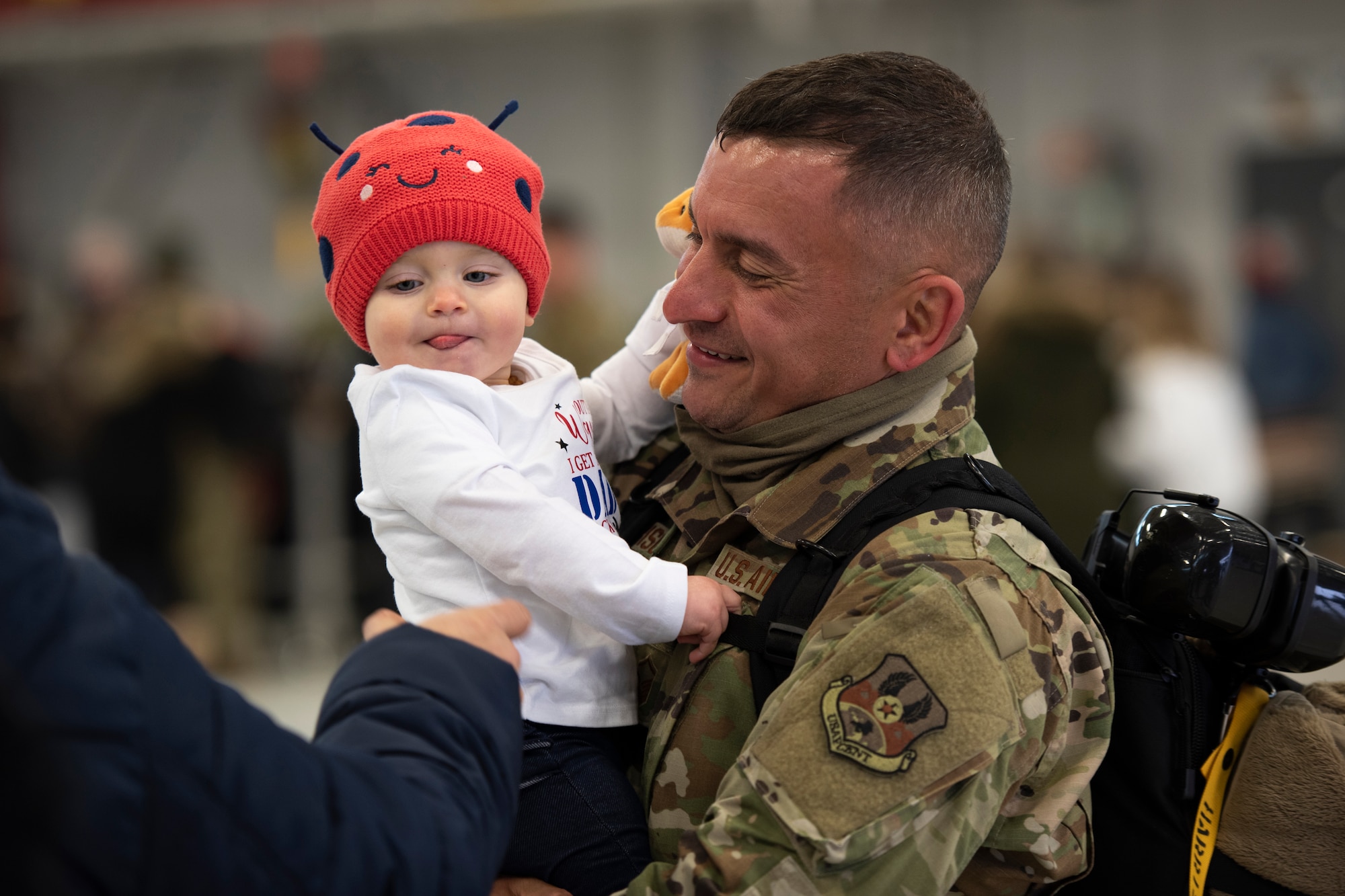 Master Sgt. David Harrison, a network systems operator, assigned to the Ohio National Guard’s 180th Fighter Wing, hold his daughter after returning home from their overseas deployment, Jan. 26, 2020 at the 180FW in Swanton, Ohio.