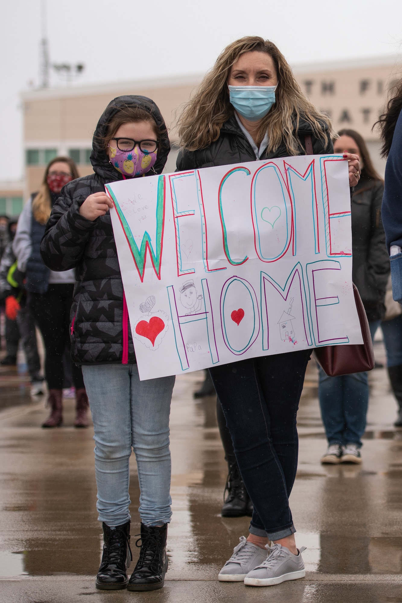 Family members await the return Airmen after an overseas deployment, Jan. 26, 2020 at the 180FW in Swanton, Ohio.