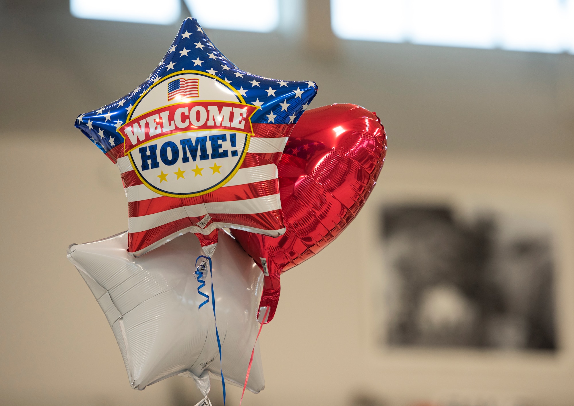 Friends and family bring balloons to welcome Airmen home from deployment, Jan. 26, 2020 at the 180FW in Swanton, Ohio.