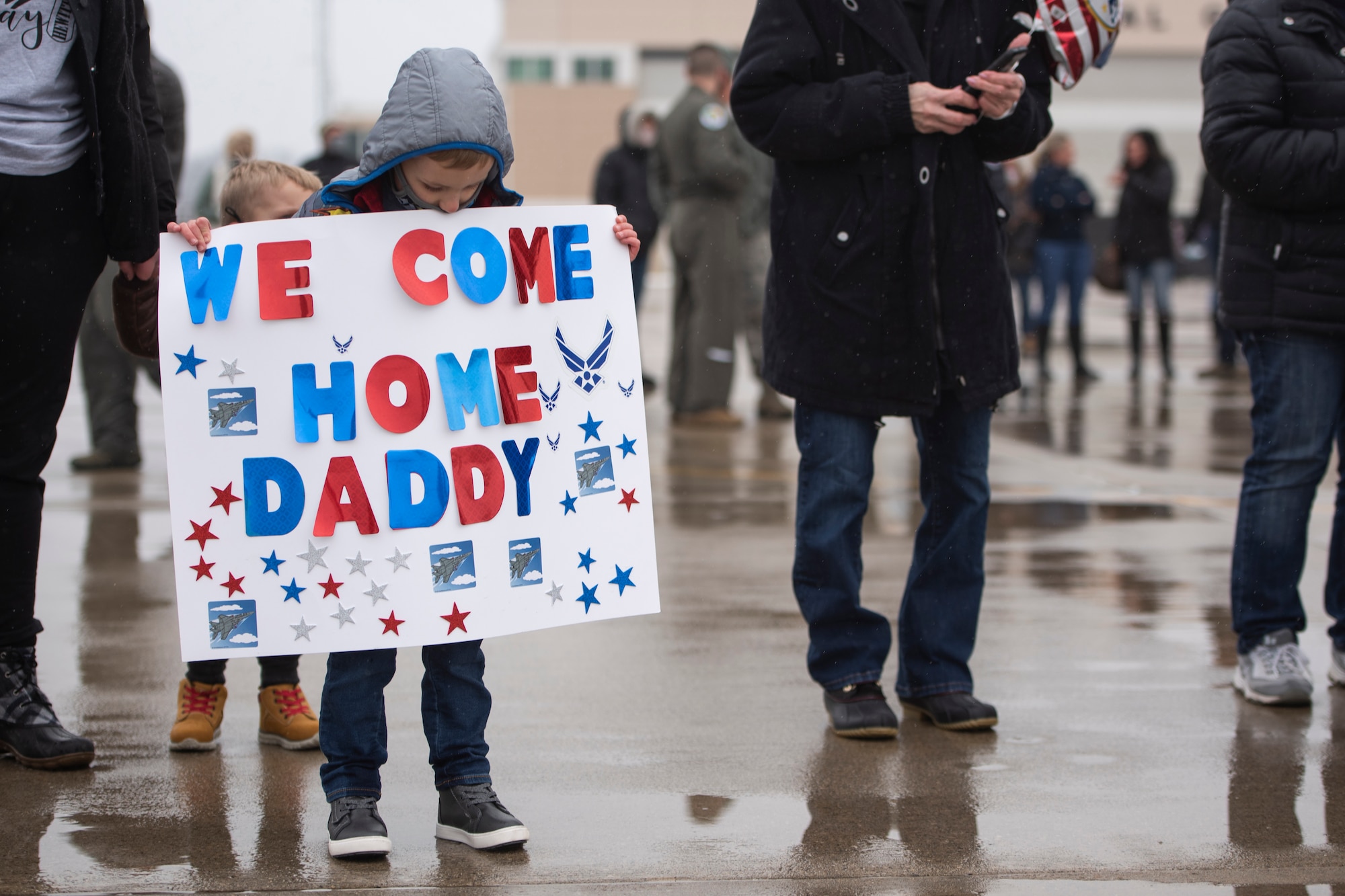 A child waits the return of his father after an overseas deployment, Jan. 26, 2020 at the 180FW in Swanton, Ohio.