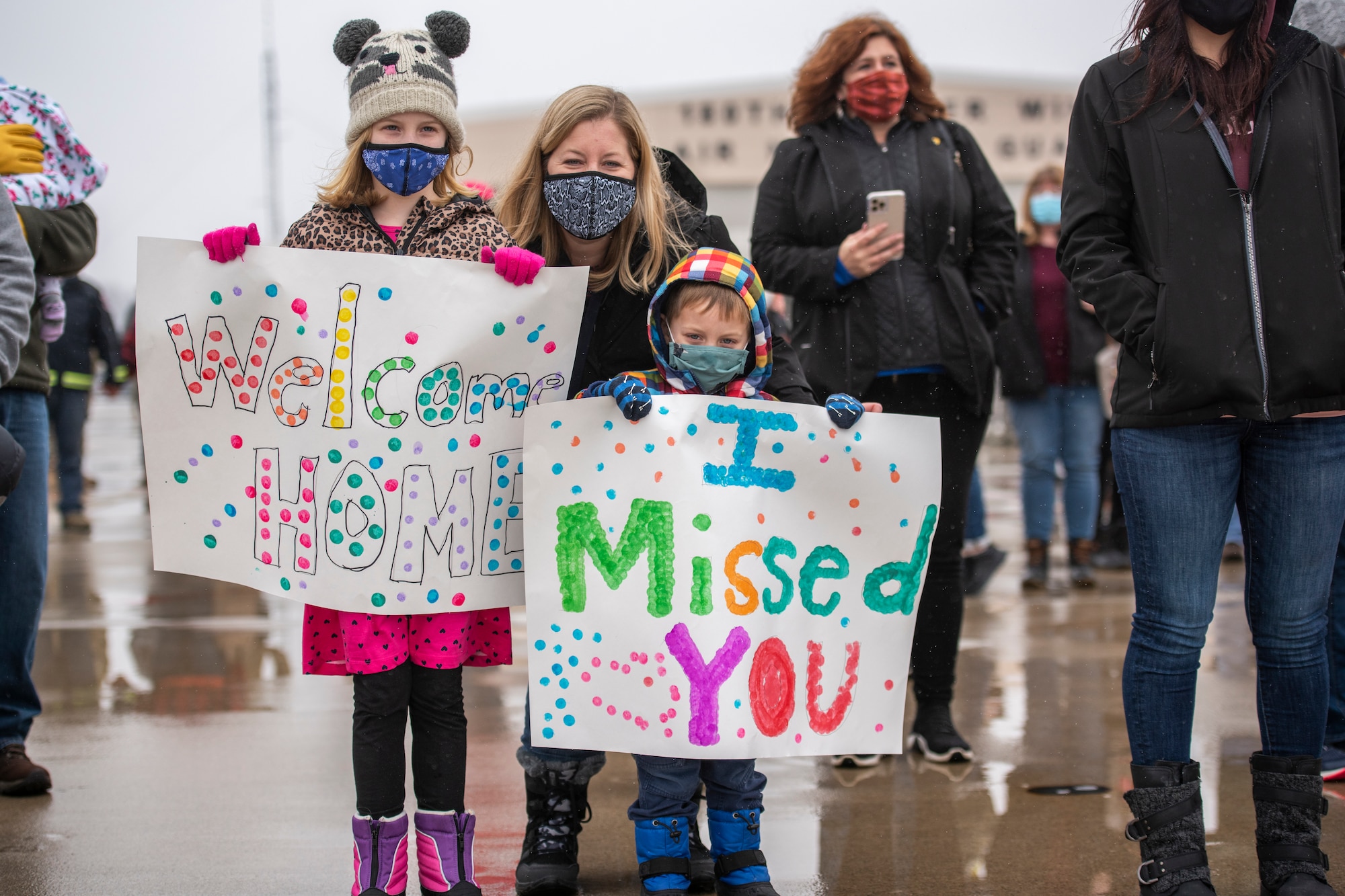 Family members await the return Airmen after an overseas deployment, Jan. 26, 2020 at the 180FW in Swanton, Ohio.
