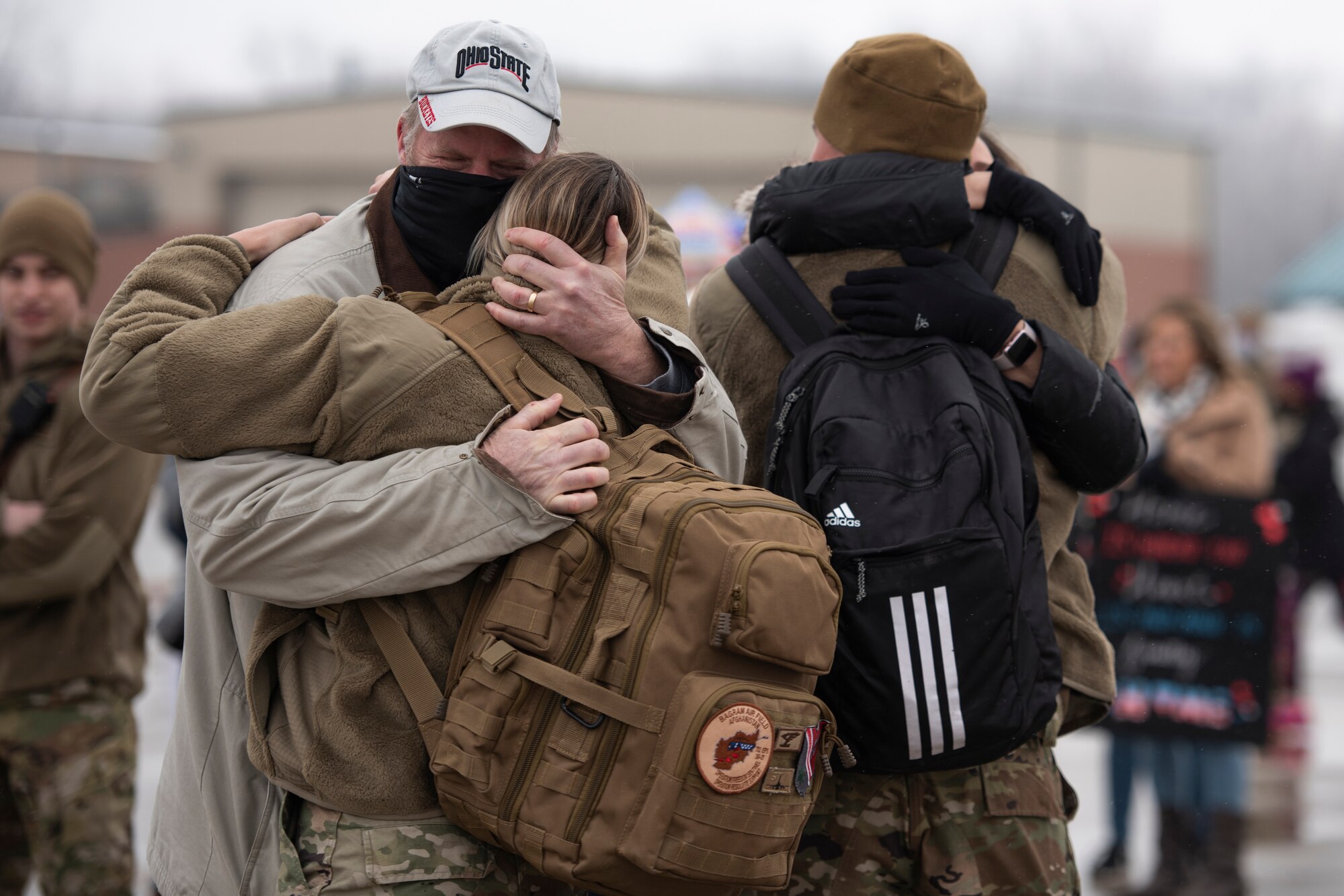 Staff Sgt. Courtney Iannucci, an intelligence specialist, and Staff Sgt. Alex Iannucci, a crew chief, assigned to the Ohio National Guard’s 180th Fighter Wing, embrace loved ones after returning home from their overseas deployment, Jan. 26, 2020 at the 180FW in Swanton, Ohio.