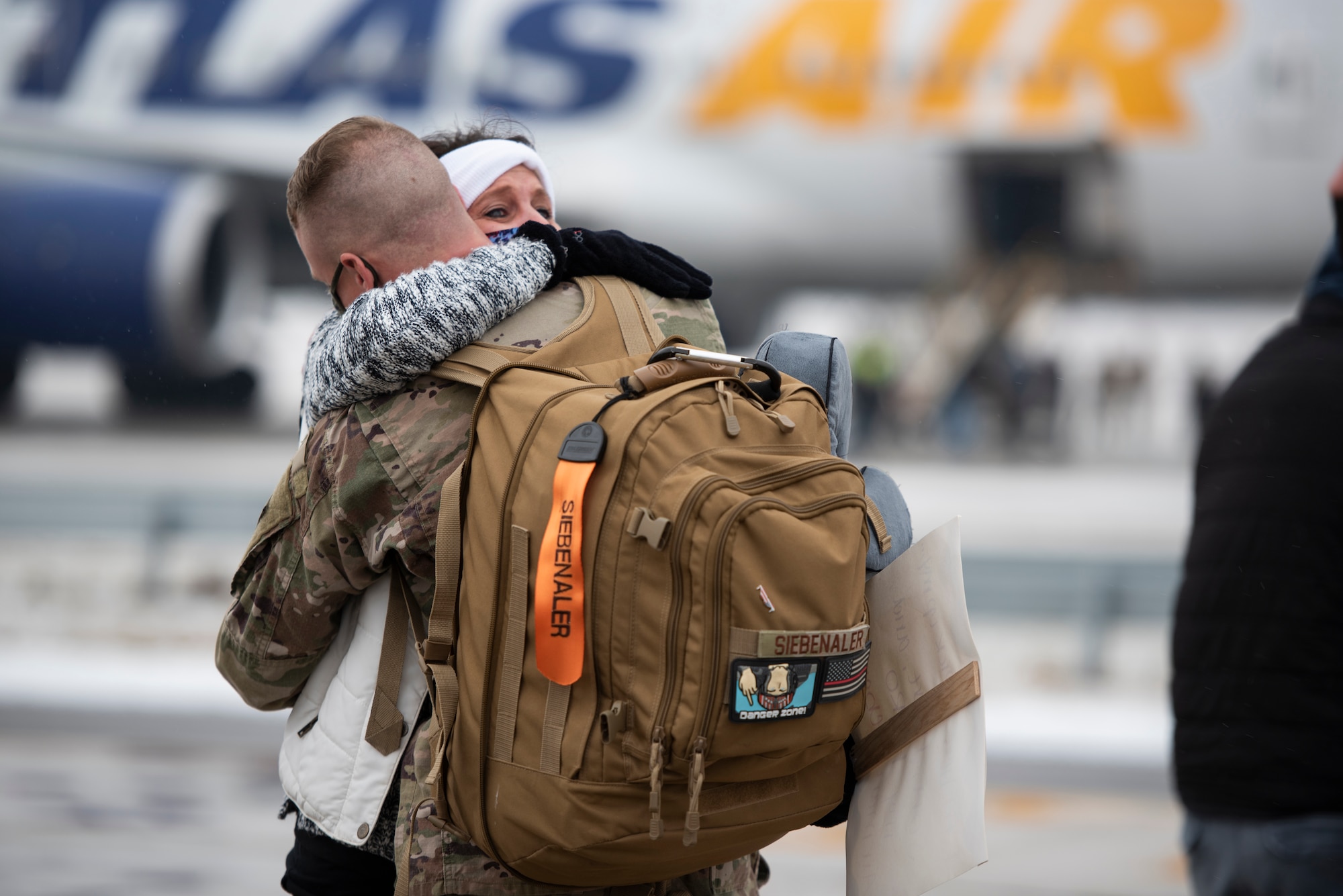 A U.S. Airman, assigned to the Ohio National Guard’s 180th Fighter Wing, embraces a loved one after returning home from an overseas deployment, Jan. 26, 2020 at the 180FW in Swanton, Ohio.