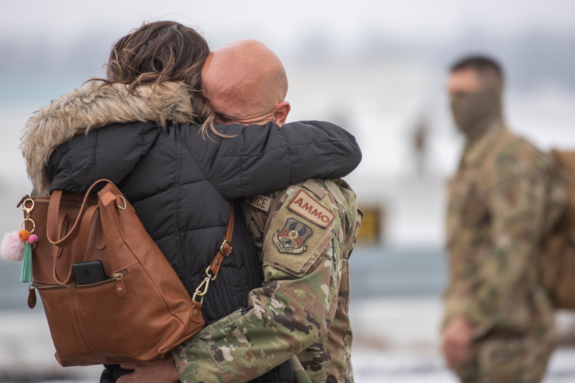 A U.S. Airman, assigned to the Ohio National Guard’s 180th Fighter Wing, embraces a loved one after returning home from an overseas deployment, Jan. 26, 2020 at the 180FW in Swanton, Ohio.