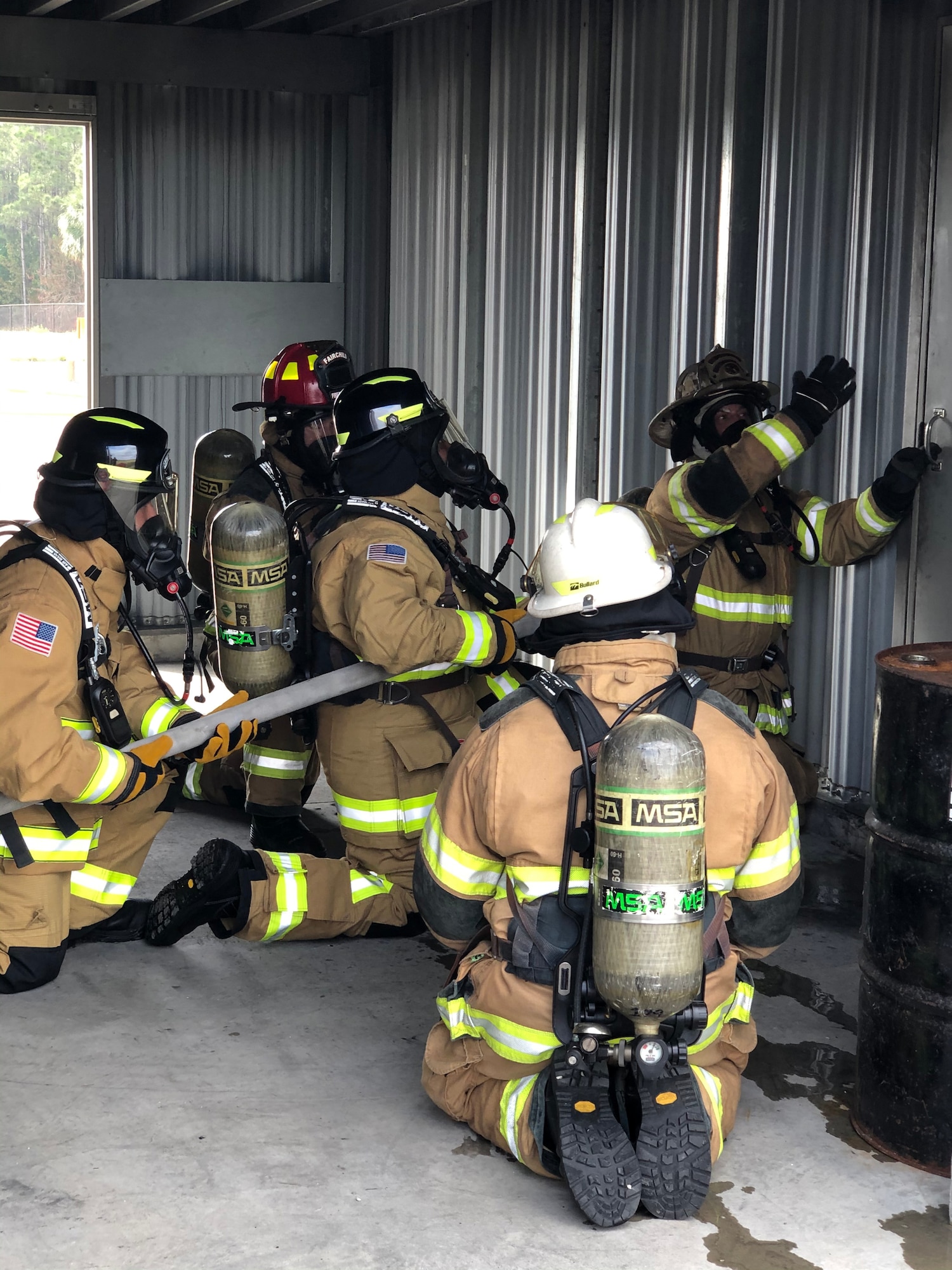 MacDill Airmen receive instruction from 6th Civil Engineer Squadron Fire Emergency Services Flight firefighters during an interior structural firefighting training, March 23, 2021 at MacDill Air Force Base, Fla.