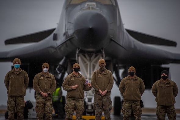 Airmen assigned to the 1st Combat Communications Squadron at Ramstein Air Base, Germany, stand in front of a B-1B Lancer at Ørland Air Force Station, Norway, March 23, 2020. The 1st CBCS Airmen deployed to Ørland AFS to support the 9th Expeditionary Bomb Squadron during a Bomber Task Force Europe deployment. (U.S. Air Force photo by Airman 1st Class Colin Hollowell)