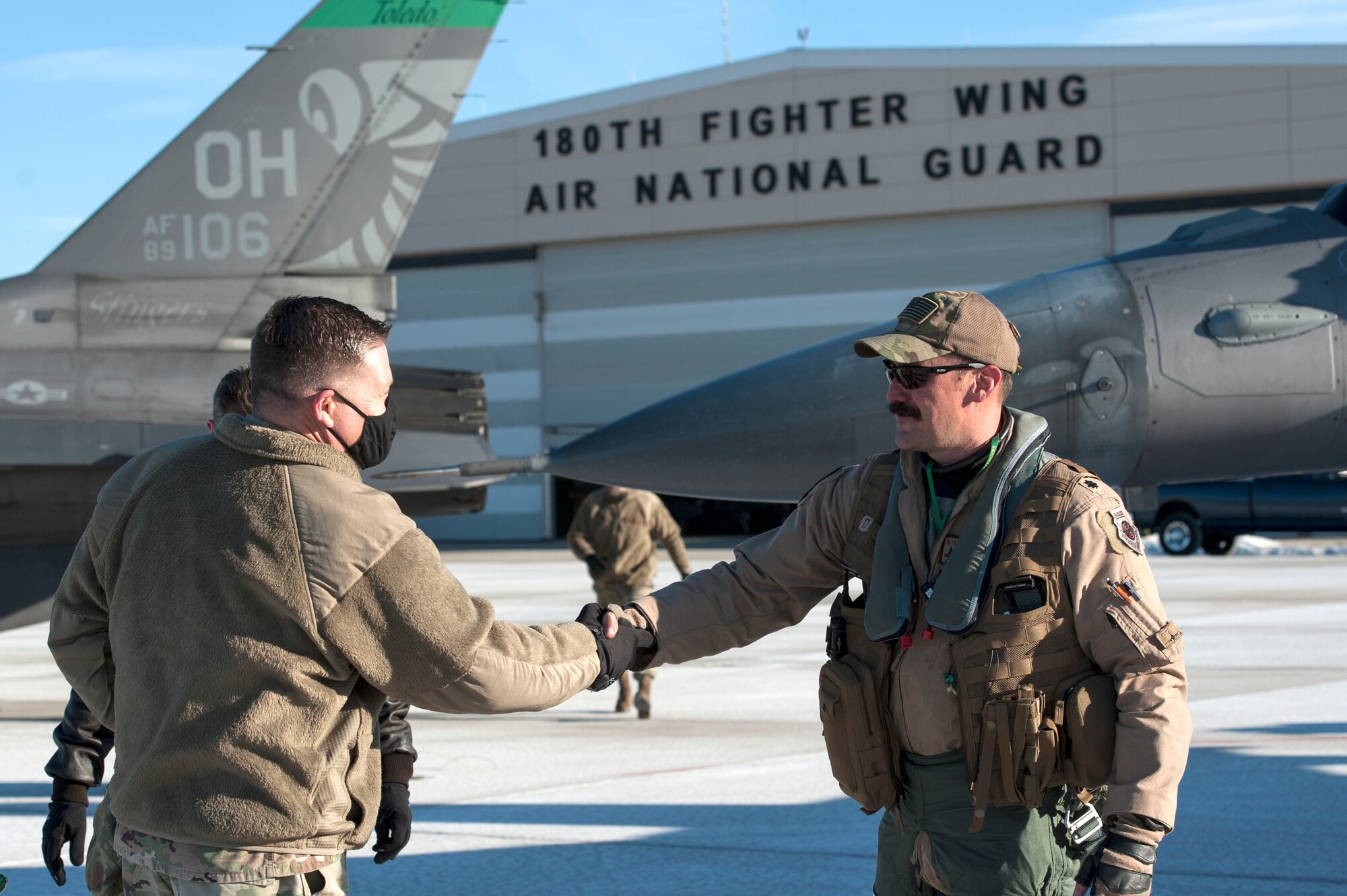 Ohio National Guard, Assistant Adjutant General-Air, Maj. Gen. James Camp, greets F-16 Fighting Falcon pilot, Lt. Col. Curt Voltz, assigned to the Ohio National Guard’s 180th Fighter Wing after Voltz returned home from a three-month Aerospace Expeditionary Force deployment to Bagram Air Base, Afghanistan, Jan. 23, 2021.