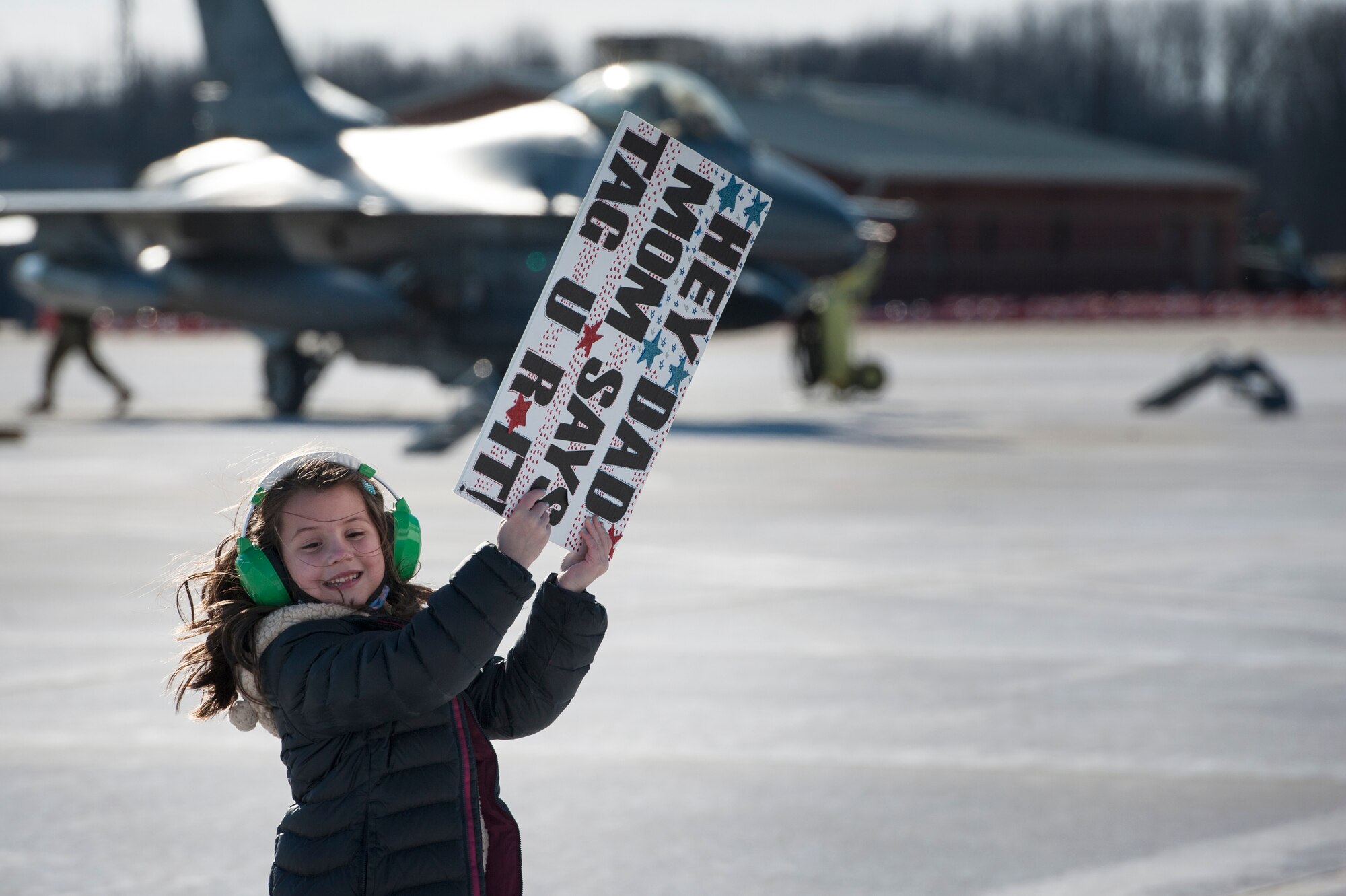 The daughter of a U.S. Air Force F-16 Fighting Falcon pilot, assigned to the Ohio National Guard’s 180th Fighter Wing, waits to greet her father following a three-month Aerospace Expeditionary Force deployment to Bagram Air Base, Afghanistan, Jan. 23, 2021.
