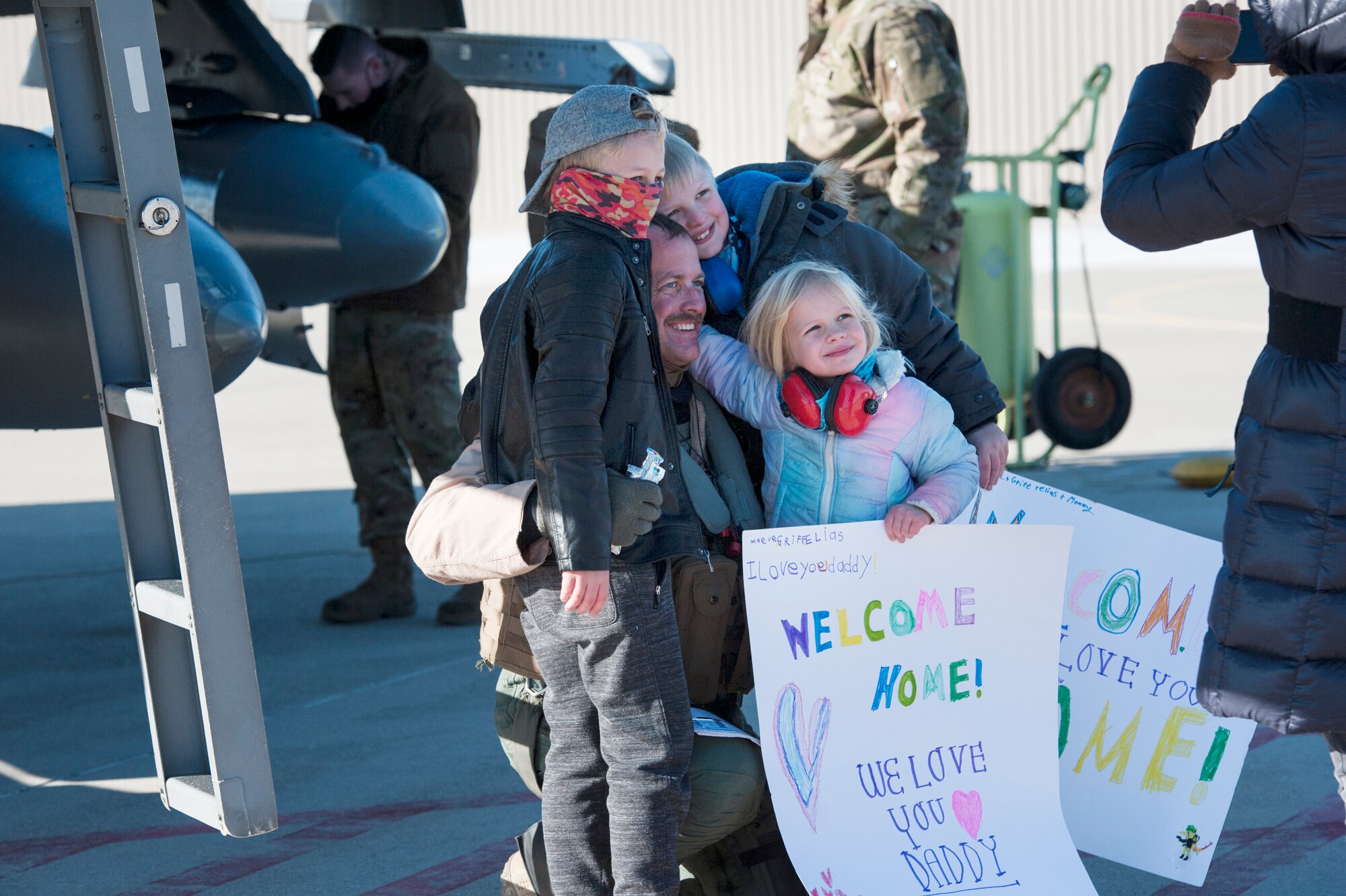 U.S. Air Force F-16 Fighting Falcon pilot, Lt. Col. Brian Moran, assigned to the Ohio National Guard’s 180th Fighter Wing, greets his family for the first time after returning home from a three-month Aerospace Expeditionary Force deployment to Bagram Air Base, Afghanistan, Jan. 23, 2021.