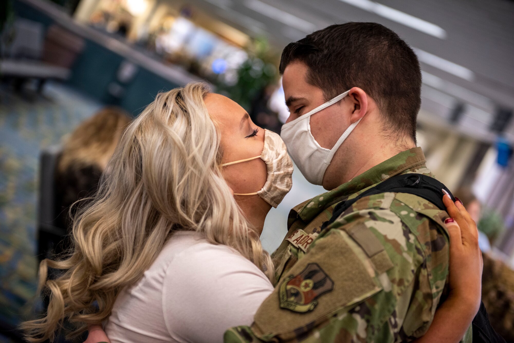 A U.S. Airman, assigned to the Ohio National Guard’s 180th Fighter Wing, embraces a loved one after returning home from an overseas deployment, Dec. 31, 2020 at the Eugene F. Kranz Toledo Express Airport.