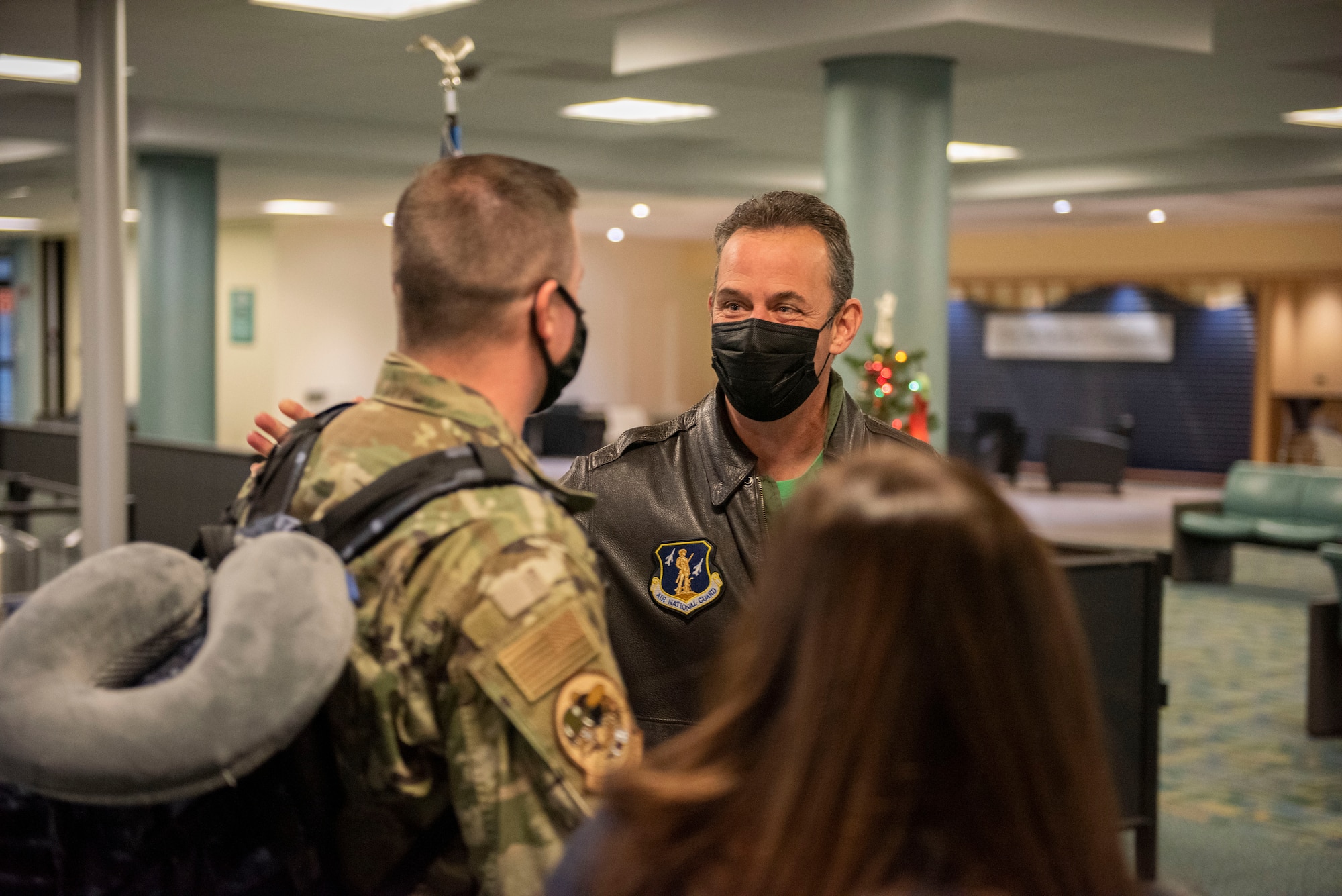 U.S. Air Force Col. Michael DiDio, Commander of the Ohio National Guard’s 180th Fighter Wing, welcomes an Airman home after returning from an overseas deployment, Dec. 31, 2020 at the Eugene F. Kranz Toledo Express Airport.