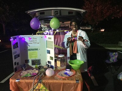 Tiffany Owens, a lead system safety engineer in Naval Surface Warfare Center Dahlgren Division (NSWCDD) Dam Neck Activity’s Technology Integration Safety Branch, gives a Science, Technology, Engineering and Math (STEM) presentation on glow and luminescence during the “Light Up the Night” event Oct. 31, 2019, in Richmond, Virginia. Owens was recently recognized by the Department of Defense as STEM Advocate of the Quarter for her work with local community youth on behalf of NSWCDD, as well as various STEM outreach efforts she leads through her church and other professional organizations.