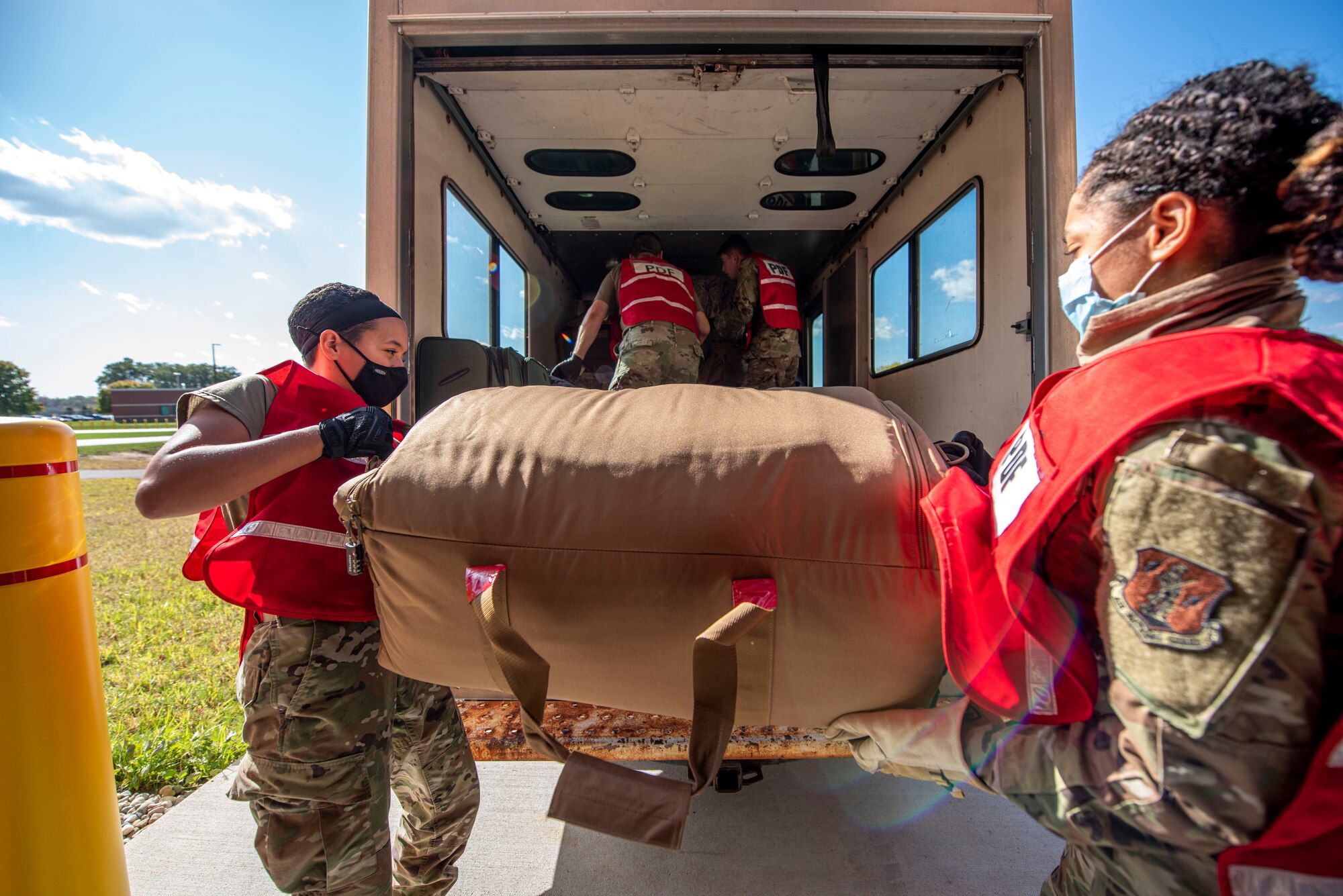 U.S. Airmen, assigned to the Ohio National Guard’s 180th Fighter Wing, load baggage at the 180FW in Swanton, Ohio, Oct. 7, 2020.