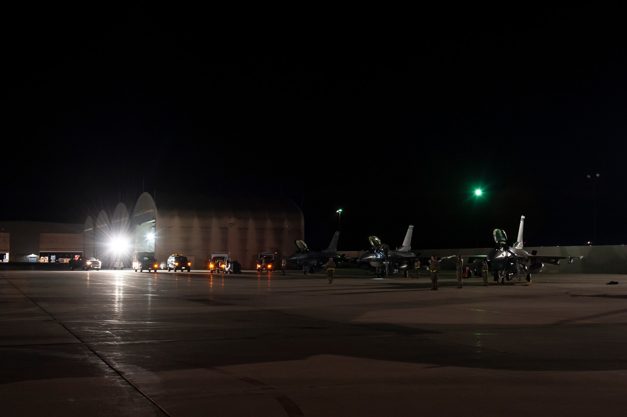 U.S. Air Force Airmen, assigned to the Ohio National Guard’s 180th Fighter Wing, prepare F-16 Fighting Falcon fighter jets for an Aerospace Expeditionary Force deployment in the early morning hours, Oct. 12, 2020, at the 180FW in Swanton, Ohio.
