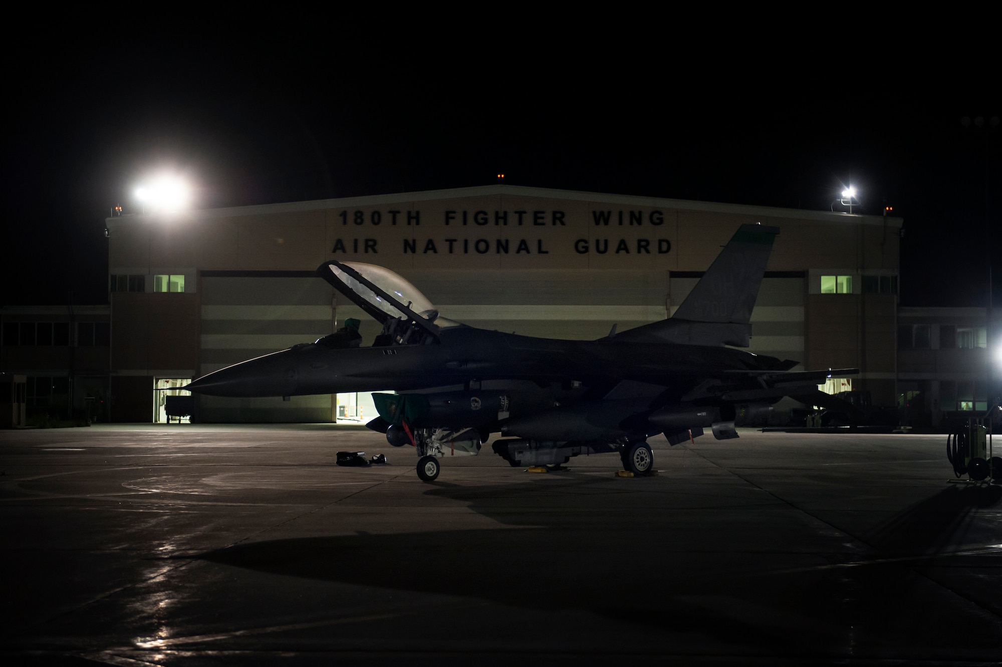 An F-16 Fighting Falcon fighter jet, assigned to the Ohio National Guard’s 180th Fighter Wing, sits ready on the flightline in the early morning hours, O.t. 12, 2020, before departing from the 180FW, in Swanton, Ohio, for an Aerospace Expeditionary Force deployment.