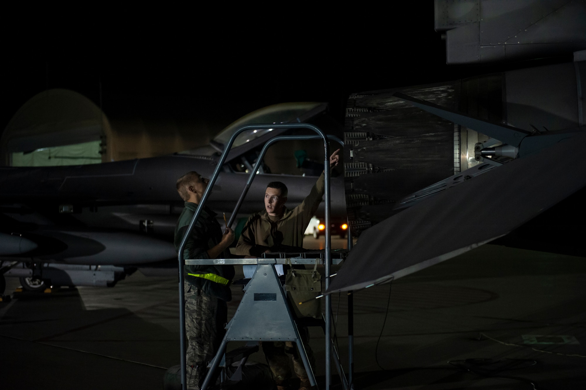 U.S. Air Force Airmen, assigned to the Ohio National Guard’s 180th Fighter Wing, prepare an F-16 Fighting Falcon fighter jet for an Aerospace Expeditionary Force deployment in the early morning hours, Oct. 12, 2020, at the 180FW in Swanton, Ohio.