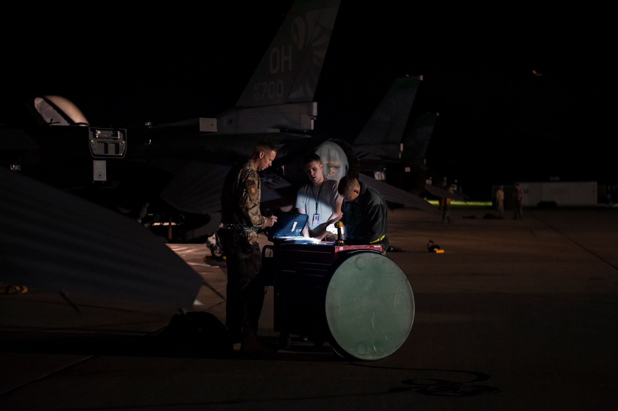U.S. Air Force Airmen, assigned to the Ohio National Guard’s 180th Fighter Wing, prepare an F-16 Fighting Falcon fighter jet for an Aerospace Expeditionary Force deployment in the early morning hours, Oct. 12, 2020, at the 180FW in Swanton, Ohio.
