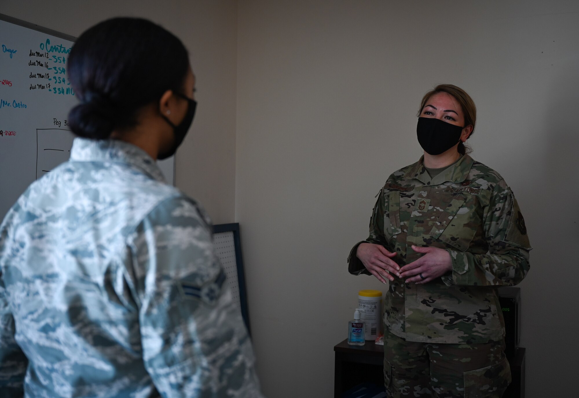 U.S. Air Force Airman 1st Class Tori Turner, a 354th Communication Squadron (CS) knowledge management technician, talks to Chief Master Sgt. Bridget Bruhn, the 354th CS superintendent, at Eielson Air Force Base, Alaska, March 22, 2021