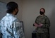 U.S. Air Force Airman 1st Class Tori Turner, a 354th Communication Squadron (CS) knowledge management technician, talks to Chief Master Sgt. Bridget Bruhn, the 354th CS superintendent, at Eielson Air Force Base, Alaska, March 22, 2021