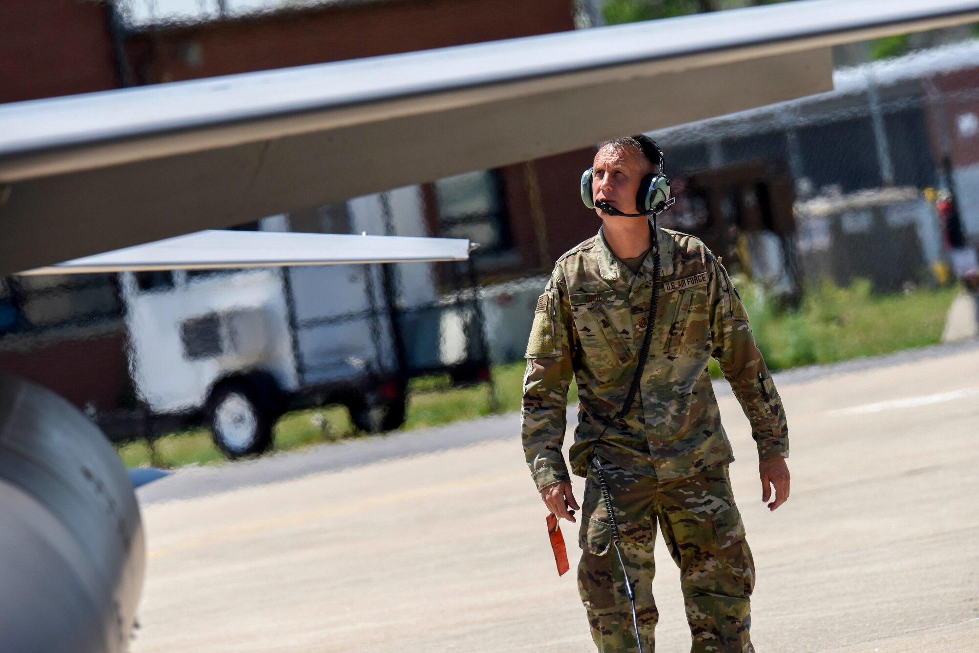 U.S. Air Force Master Sgt. Terry Copic, a crew chief assigned to the 113th Wing, D.C. Air National Guard, conducts pre-flight checks on an F-16 Fighting Falcon, piloted by his nephew, 1st Lt. T.J. Copic, an F-16 fighter pilot assigned to the 180th Fighter Wing, before a training flight at the 180FW in Swanton, Ohio, June 30, 2020.