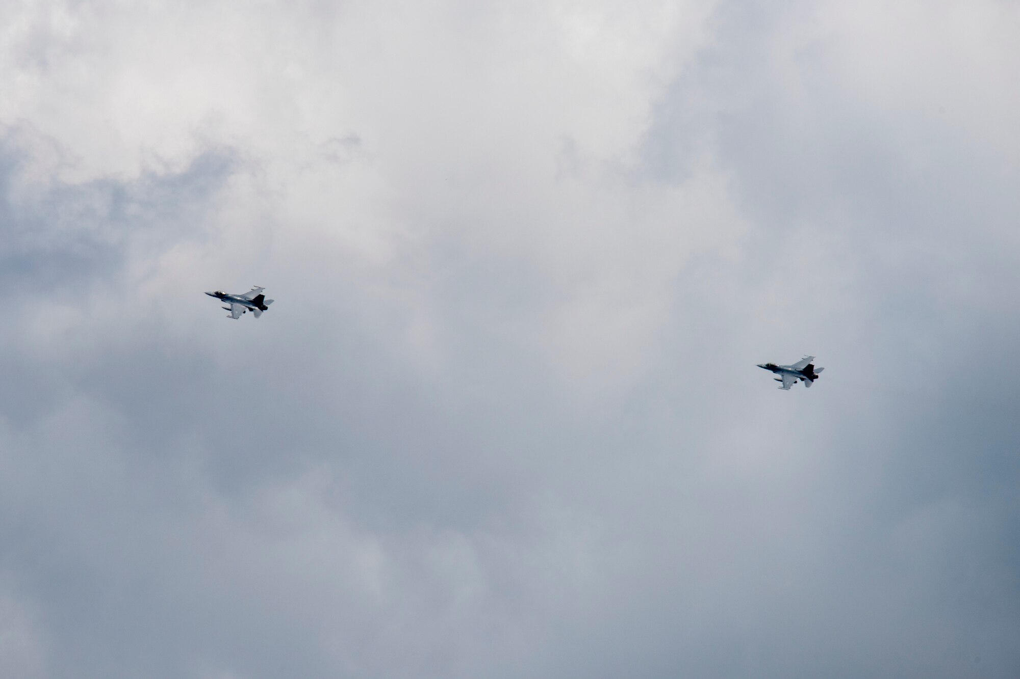 U.S. Air Force F-16 Fighting Falcons, assigned to the Ohio National Guard’s 180th Fighter Wing, fly over the 180FW during a training flight in Swanton, Ohio, Aug. 6, 2020.