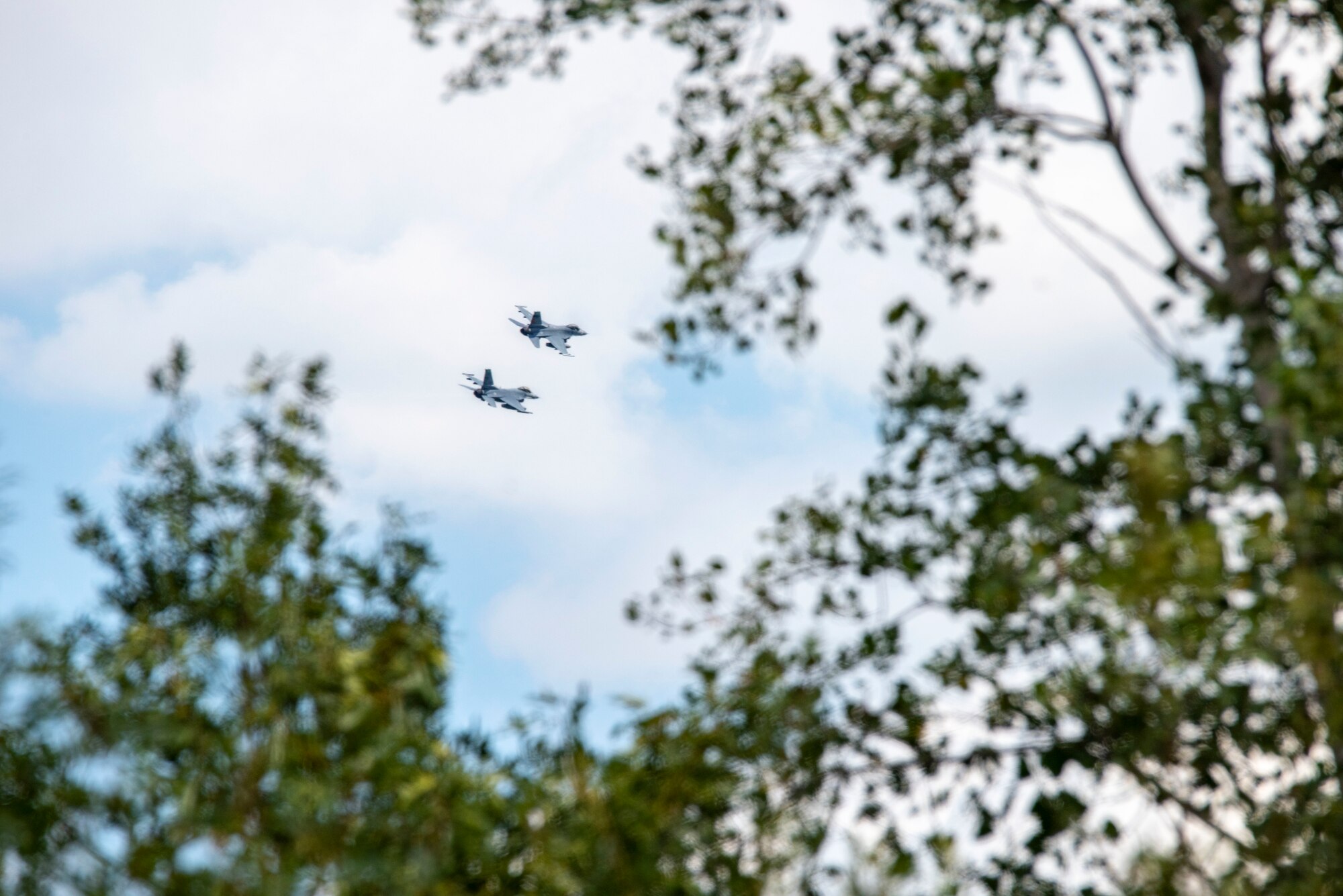 U.S. Air Force F-16 Fighting Falcons, assigned to the Ohio National Guard’s 180th Fighter Wing, fly over the 180FW during a training flight in Swanton, Ohio, Aug. 6, 2020.