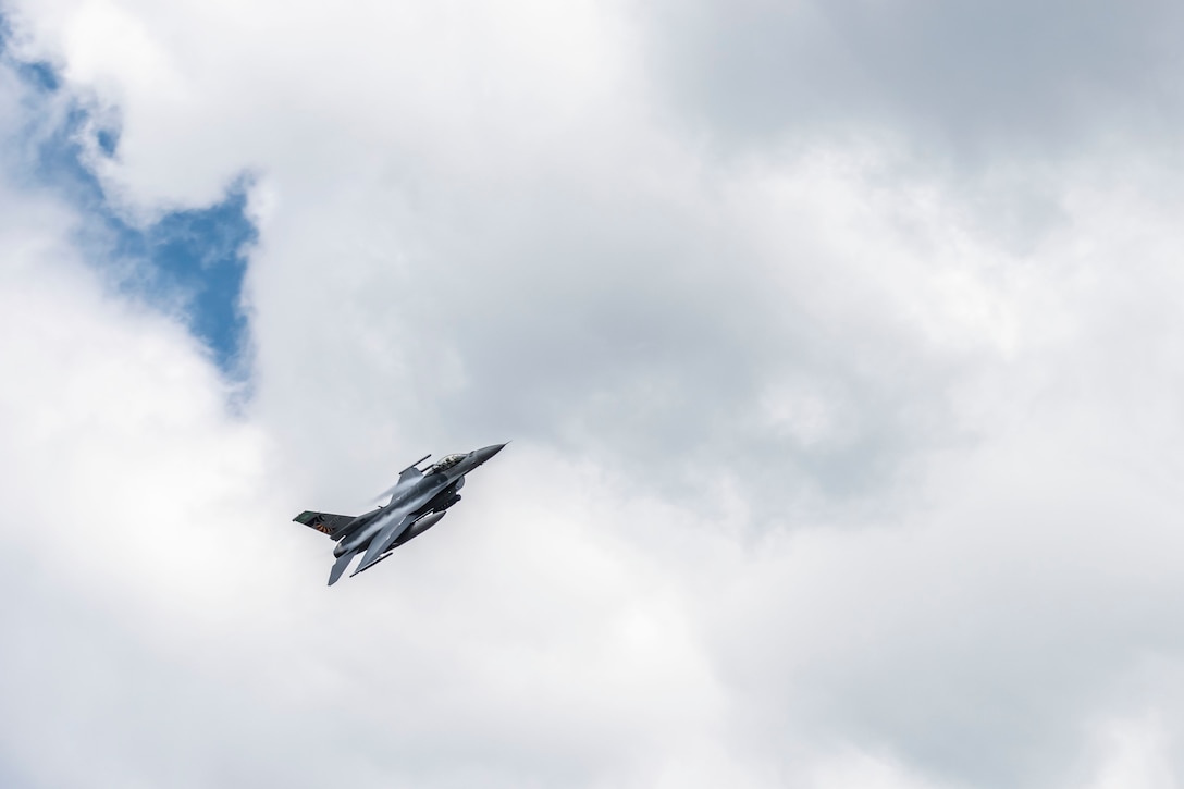 A U.S. Air Force F-16 Fighting Falcon, assigned to the Ohio National Guard’s 180th Fighter Wing, flies over the 180FW during a training flight in Swanton, Ohio, Aug. 6, 2020.