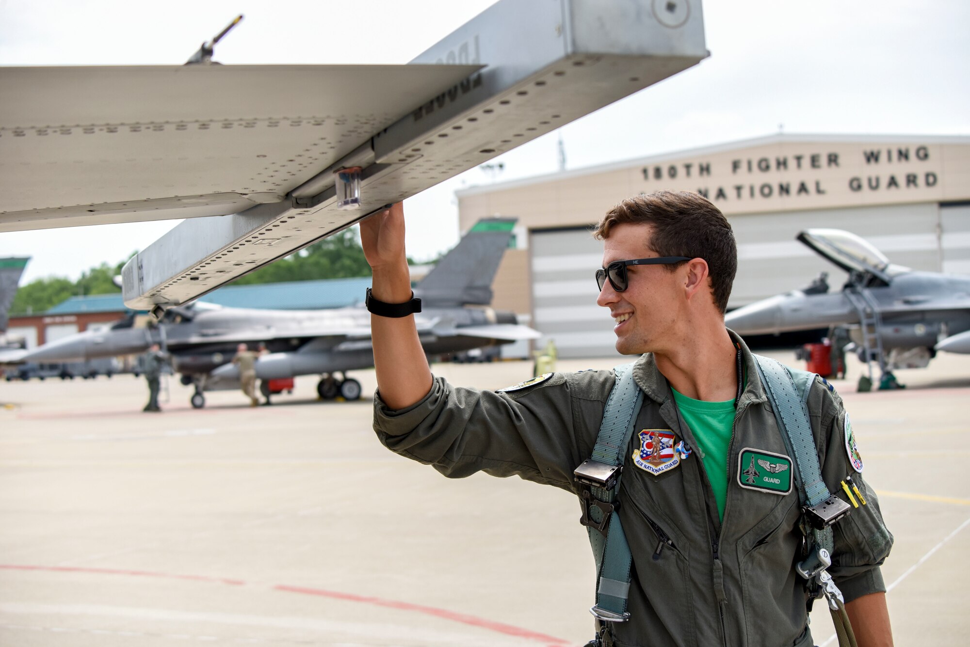 U.S. Air Force Captain William Ross, an F-16 Fighter Pilot assigned to the Ohio National Guard’s 180th Fighter Wing, conducts a pre-flight inspection of an F-16 Fighting Falcon before a training flight at the 180FW in Swanton, Ohio, July 30, 2020.