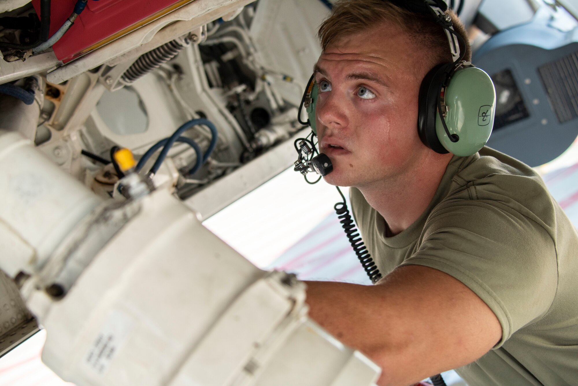 U.S. Air Force Airman 1st Class Liam McDonald, a crew chief assigned to the Ohio National Guard's 180th Fighter Wing performs a pre-flight inspection on an F-16 fighter jet before a training flight at the 180FW in Swanton, Ohio, Aug. 27, 2020.