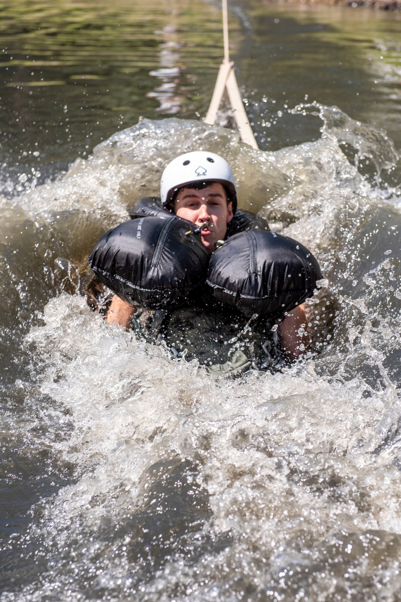 U.S. Air Force Capt. Robert Lowery, an F-16 fighter pilot assigned to the Ohio National Guard's 180th Fighter Wing, is dragged through the water during water survival training in Waterville, Ohio, Aug. 8, 2020.