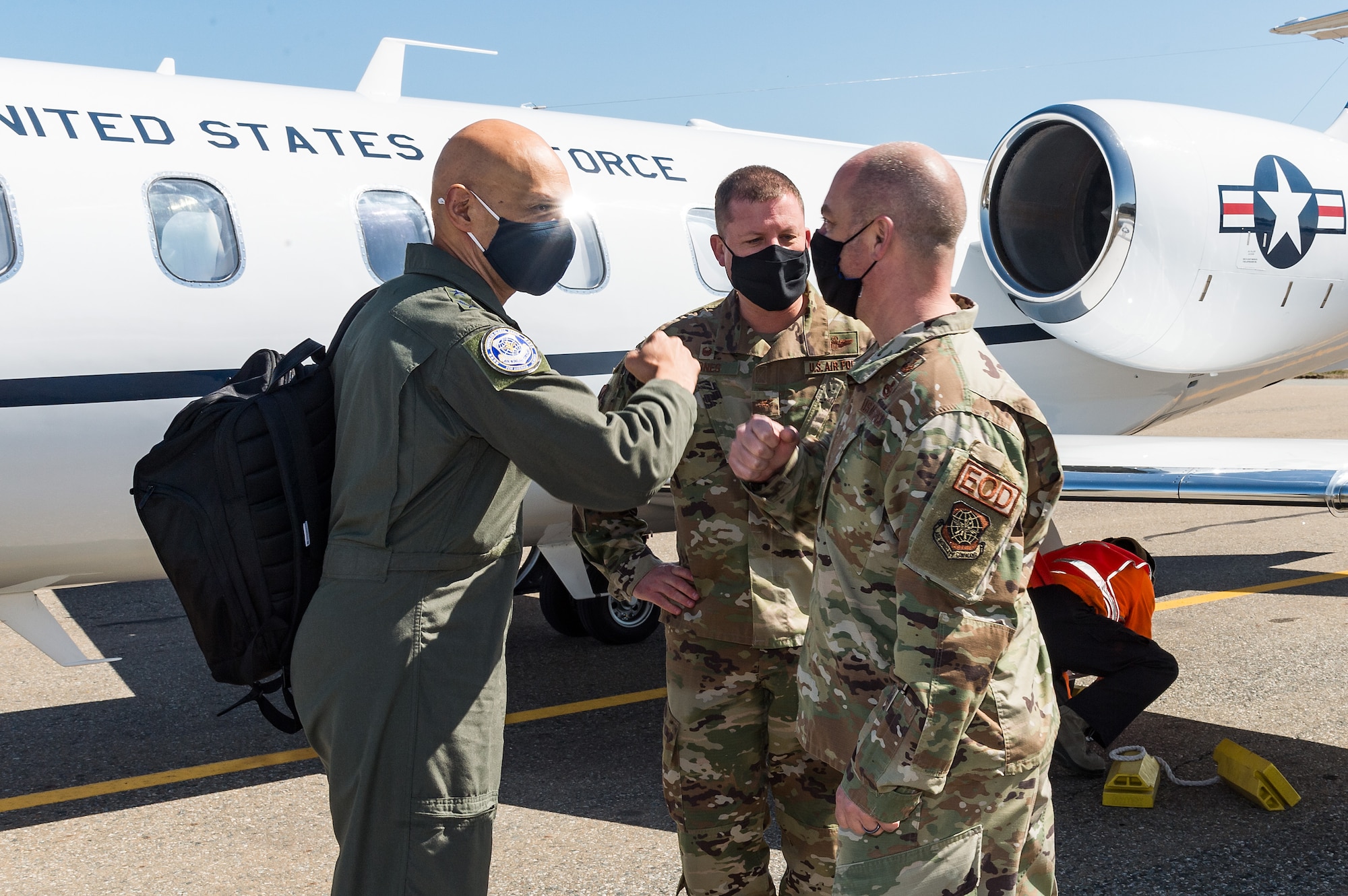 Lt. Gen. Brian Robinson, Air Mobility Command deputy commander, left, greets Chief Master Sgt. Jeremiah Grisham, 436th Airlift Wing interim command chief, at Dover Air Force Base, Delaware, March 22, 2021. Robinson came to Dover AFB to engage with base leaders and fulfill training requirements. (U.S. Air Force photo by Roland Balik)