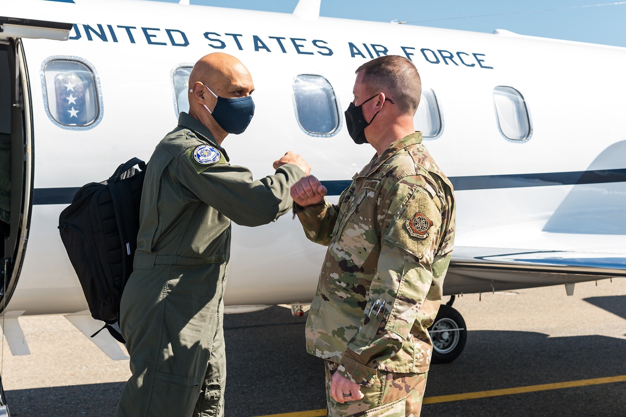 U.S. Air Force Lt. Gen. Brian Robinson, Air Mobility Command deputy commander, left, greets Col. Matthew Jones, 436th Airlift Wing commander, at Dover Air Force Base, Delaware, March 22, 2021. Robinson came to Dover AFB to engage with base leaders and fulfill training requirements. (U.S. Air Force photo by Roland Balik)