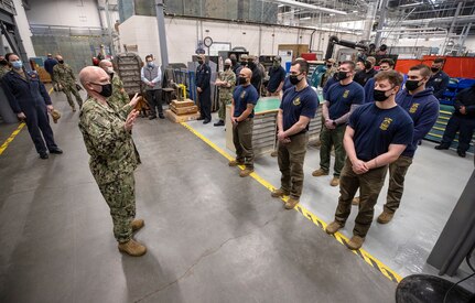 Capt. Jip Mosman, commander, Puget Sound Naval Shipyard & Intermediate Maintenance Facility, congratulates Dive Locker Sailors for a job well done March 19, 2021, during a tour of Detachment Everett at Naval Station Everett, Washington.