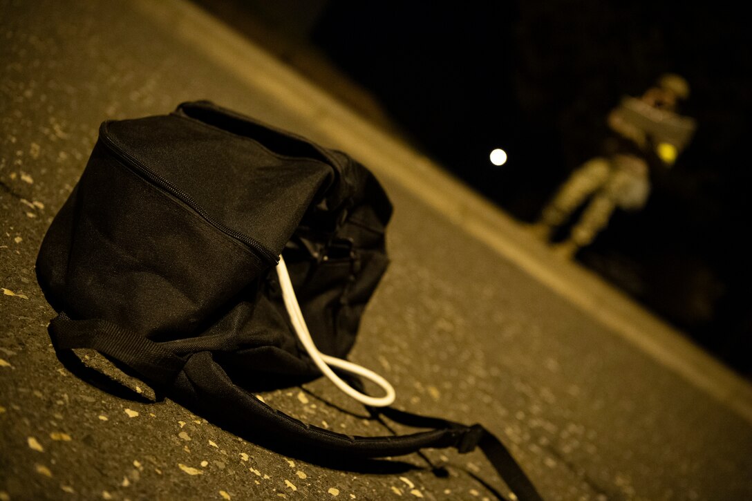 U.S. Air Force Staff Sgt. Kenyatta Davidson, 52nd Security Forces Squadron Wing Inspection Team member, notifies security forces Airmen of a suspicious package as part of Exercise AGILE SABRE on Spangdahlem Air Base, Germany, March 24, 2021.