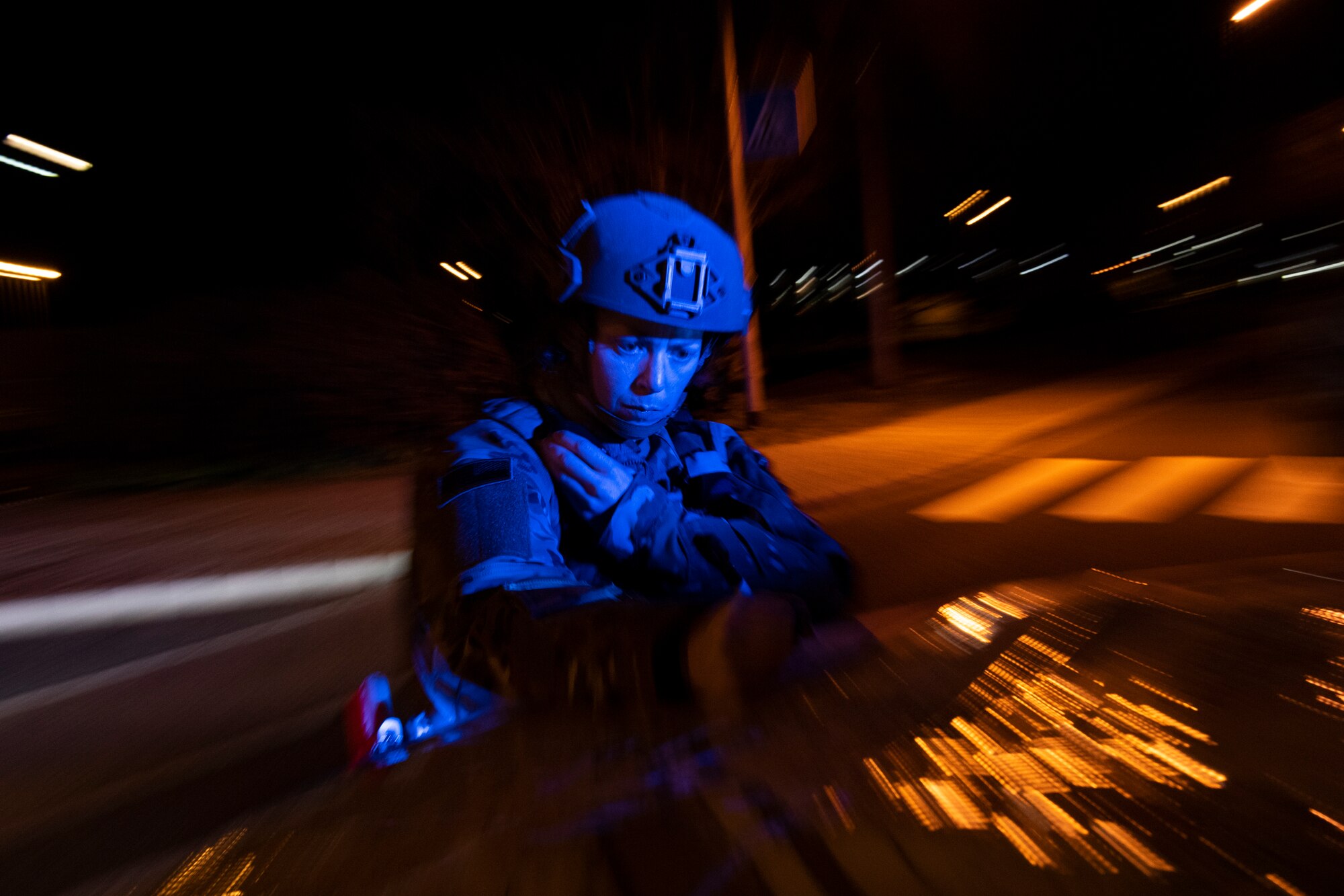 U.S. Air Force Tech. Sgt. Stephanie Gillie, 52nd Security Forces Squadron flight sergeant, communicates with Airmen from her squadron about a suspicious package as part of Exercise AGILE SABRE on Spangdahlem Air Base, Germany, March 25, 2021.