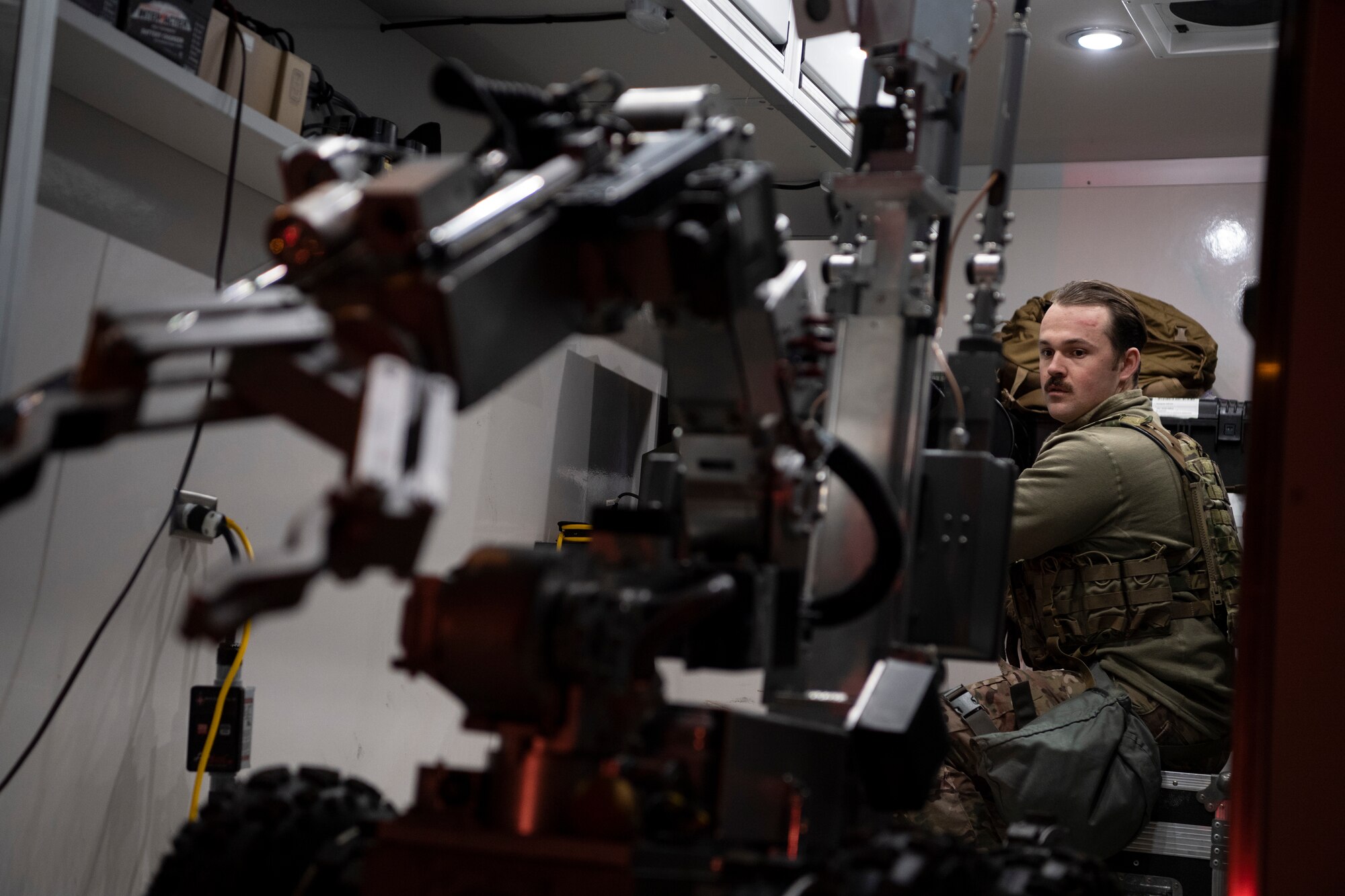 U.S. Air Force Senior Airman Stephen Maloy, 52nd Civil Engineer Squadron Explosive Ordnance Disposal technician, guides a U.S. Air Force Andros F-6 robot out of the EOD response vehicle to inspect a suspicious package during Exercise AGILE SABRE on Spangdahlem Air Base, Germany, March 25, 2021.