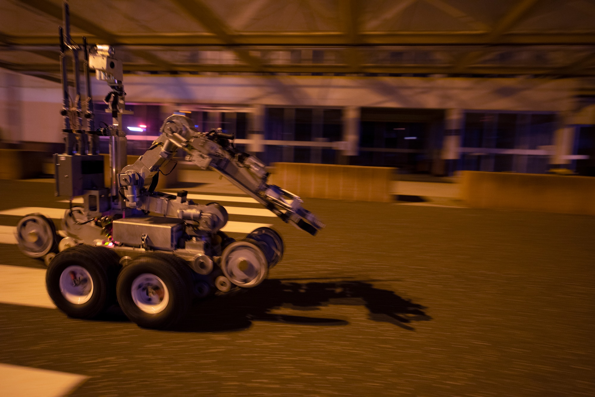 A U.S. Air Force Andros F-6 robot is driven by a 52nd Civil Engineer Squadron Explosive Ordnance Disposal Airman to inspect a suspicious package during Exercise AGILE SABRE on Spangdahlem Air Base, Germany, March 25, 2021.
