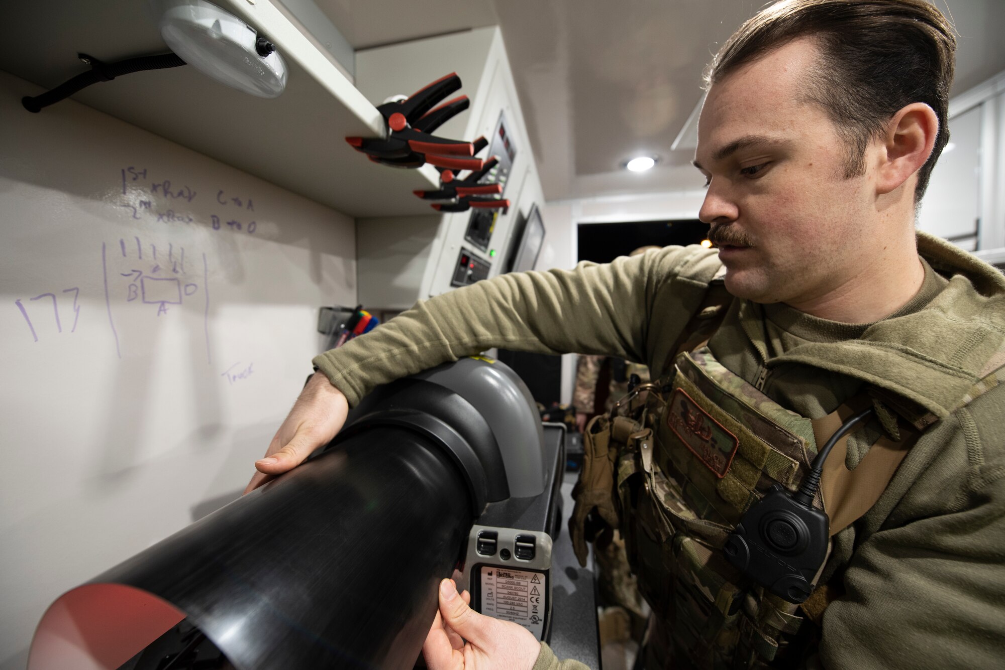 U.S. Air Force Senior Airman Stephen Maloy, 52nd Civil Engineer Squadron Explosive Ordnance Disposal technician, processes X-ray images taken of a suspicious package during Exercise AGILE SABRE on Spangdahlem Air Base, Germany, March 25, 2021.
