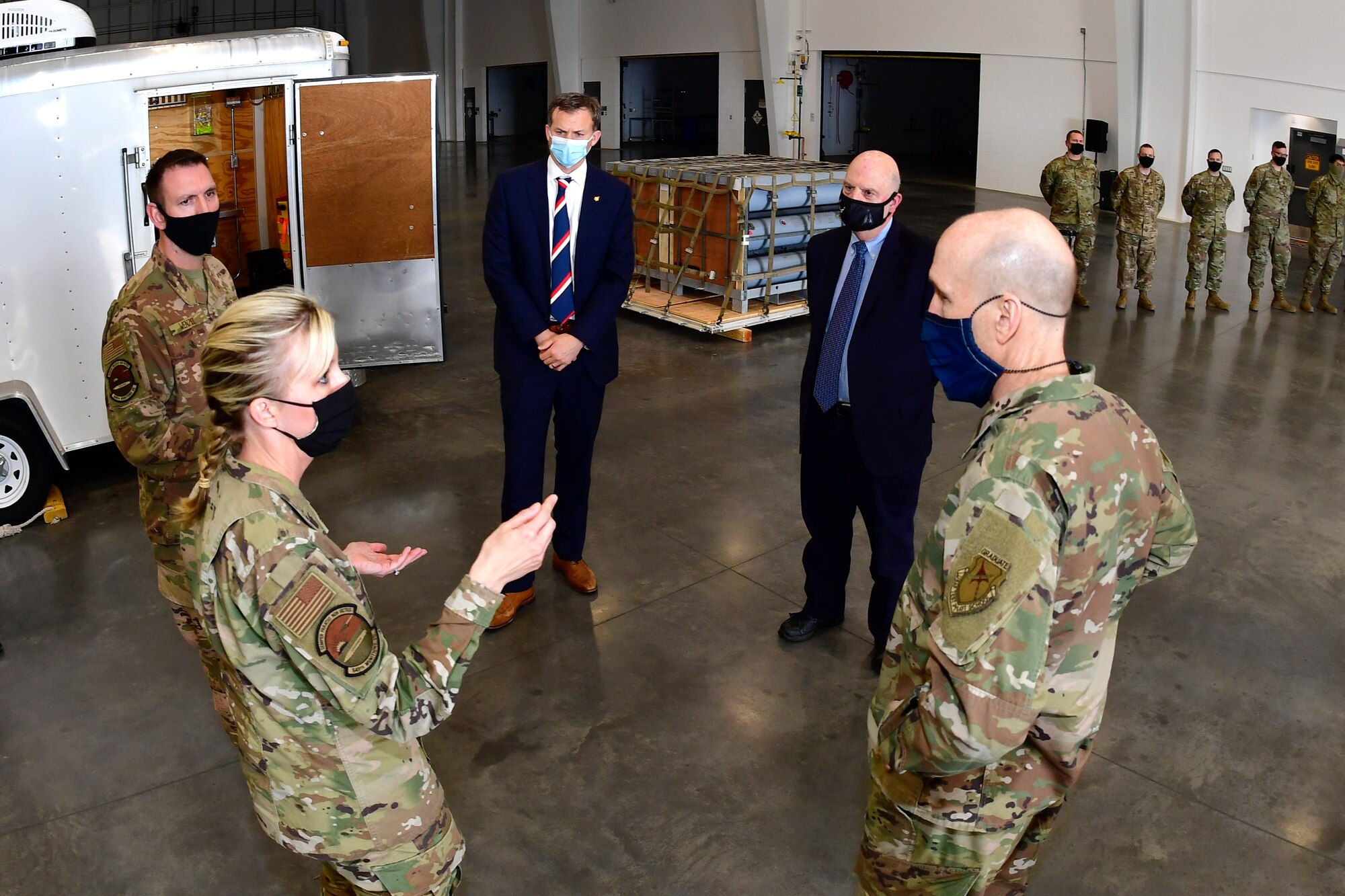 Lt. Col. Naomi Franchetti (front left), 649th Munitions Squadron commander, addresses (left to right) Senior Master Sgt. Dayton Wenzel, 649th MUNS, U.S. Rep. Blake Moore, R-Utah, Acting Secretary of the Air Force John Roth, and Gen. David Allvin, Vice Chief of Staff of the Air Force.