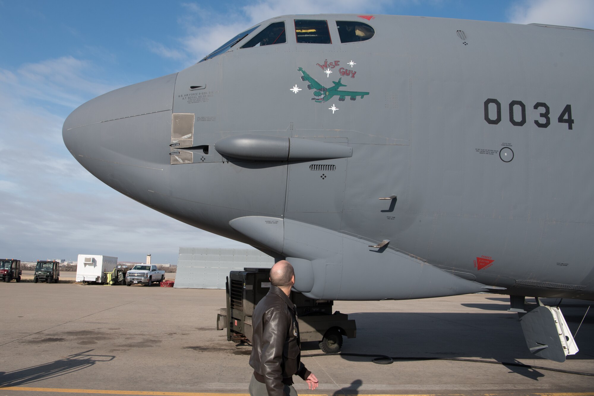 Airman looking at airplane