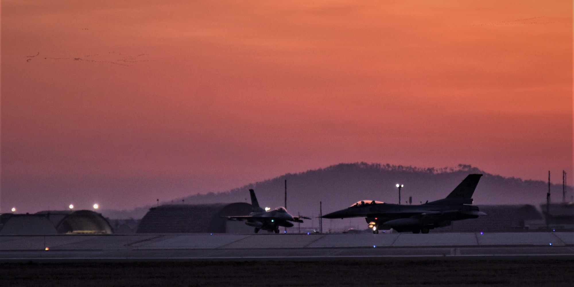 F-16 Fighting Falcons from the 8th Fighter Wing, taxi before take-off during a training event at Kunsan Air Base, Republic of Korea, March 24, 2021. The F-16 Fighting Falcon is a compact, multi-role fighter aircraft that is highly maneuverable in air-to-air combat and air-to-surface attack. It can reach top speeds of 1,500 mph and can reach altitudes of more than 50,000 feet. (U.S. Air Force photo by Tech. Sgt. Kristin S. High)