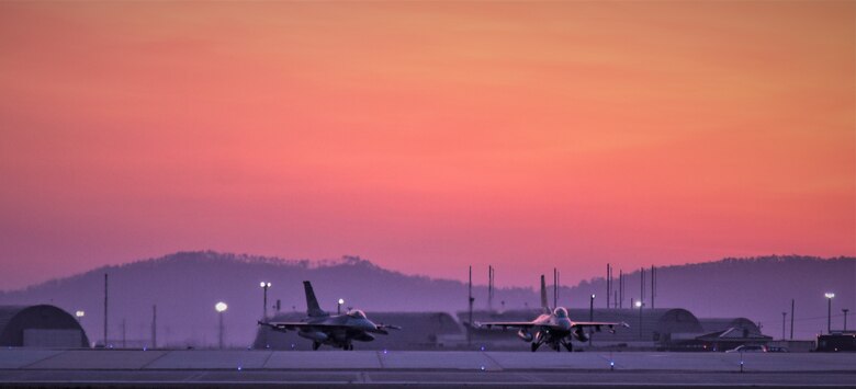 F-16 Fighting Falcons from the 8th Fighter Wing, taxi before take-off during a training event at Kunsan Air Base, Republic of Korea, March 24, 2021. The F-16 Fighting Falcon is a compact, multi-role fighter aircraft that is highly maneuverable in air-to-air combat and air-to-surface attack. It can reach top speeds of 1,500 mph and can reach altitudes of more than 50,000 feet. (U.S. Air Force photo by Tech. Sgt. Kristin S. High)