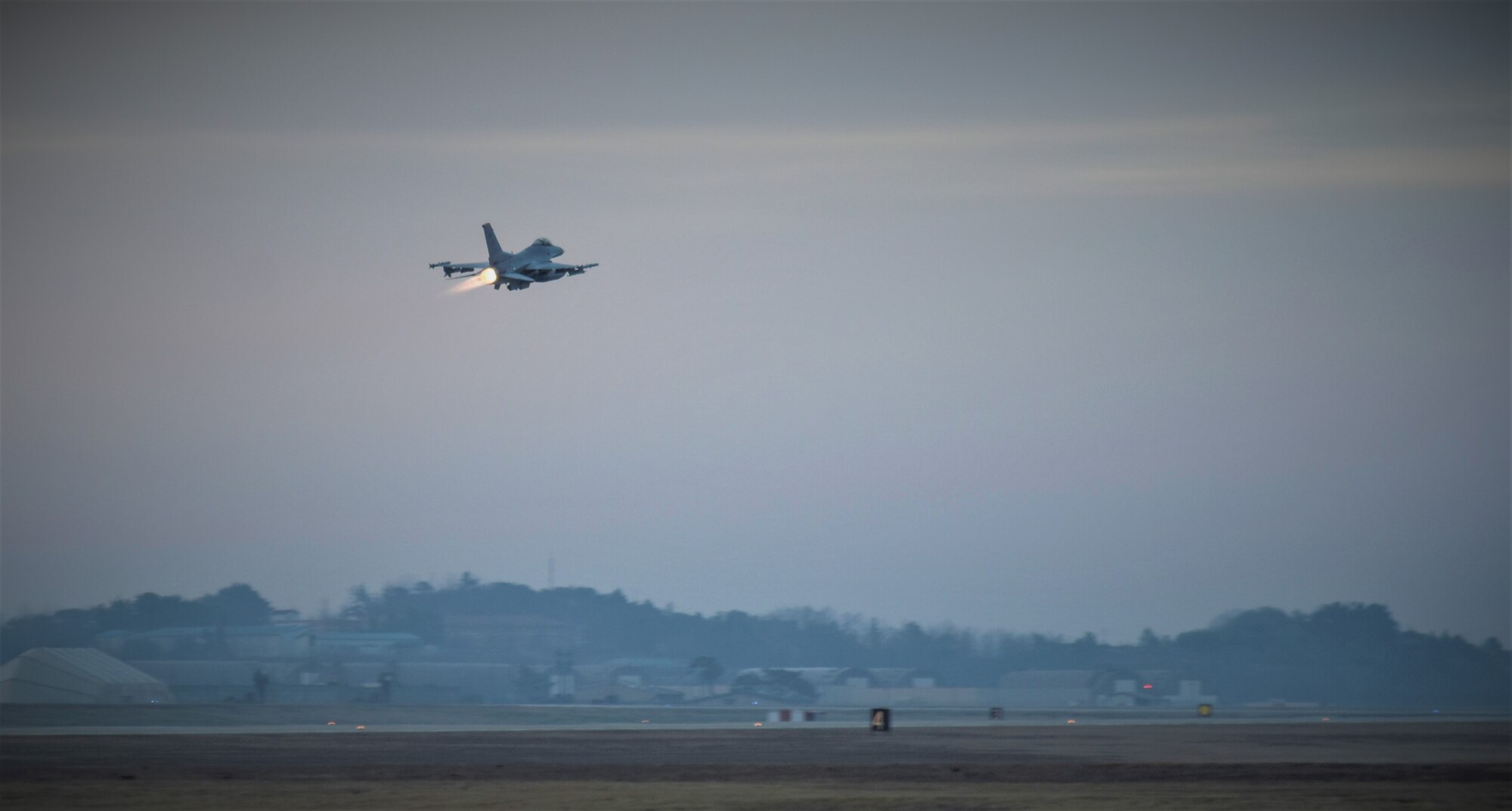 An 8th Fighter Wing F-16 Fighting Falcon takes off during a routine training event at Kunsan Air Base, Republic of Korea, March 24, 2021. The F-16 Fighting Falcon is a compact, multi-role fighter aircraft that is highly maneuverable in air-to-air combat and air-to-surface attack. It can reach top speeds of 1,500 mph and can reach altitudes of more than 50,000 feet. (U.S. Air Force photo by Tech. Sgt. Kristin S. High)