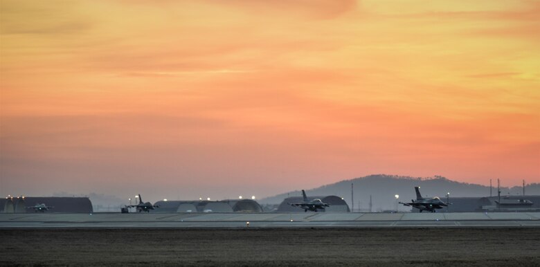 F-16 Fighting Falcons from the 8th Fighter Wing, taxi before take-off during a training event at Kunsan Air Base, Republic of Korea, March 24, 2021. The F-16 Fighting Falcon is a compact, multi-role fighter aircraft that is highly maneuverable in air-to-air combat and air-to-surface attack. It can reach top speeds of 1,500 mph and can reach altitudes of more than 50,000 feet. (U.S. Air Force photo by Tech. Sgt. Kristin S. High)