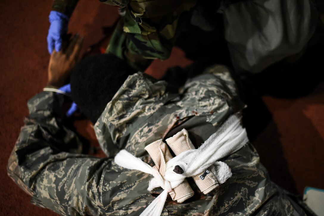 A simulated victim receives medical treatment.