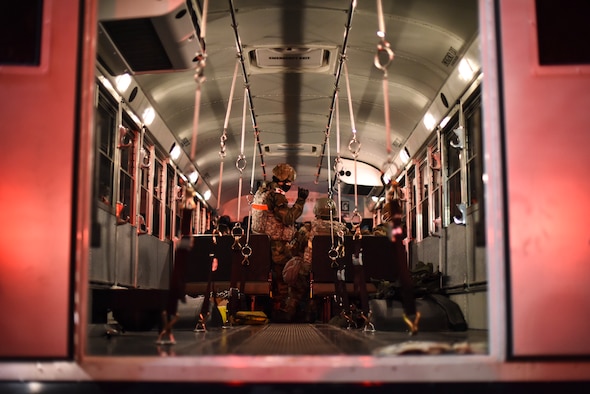 An Airman briefs simulated victims.