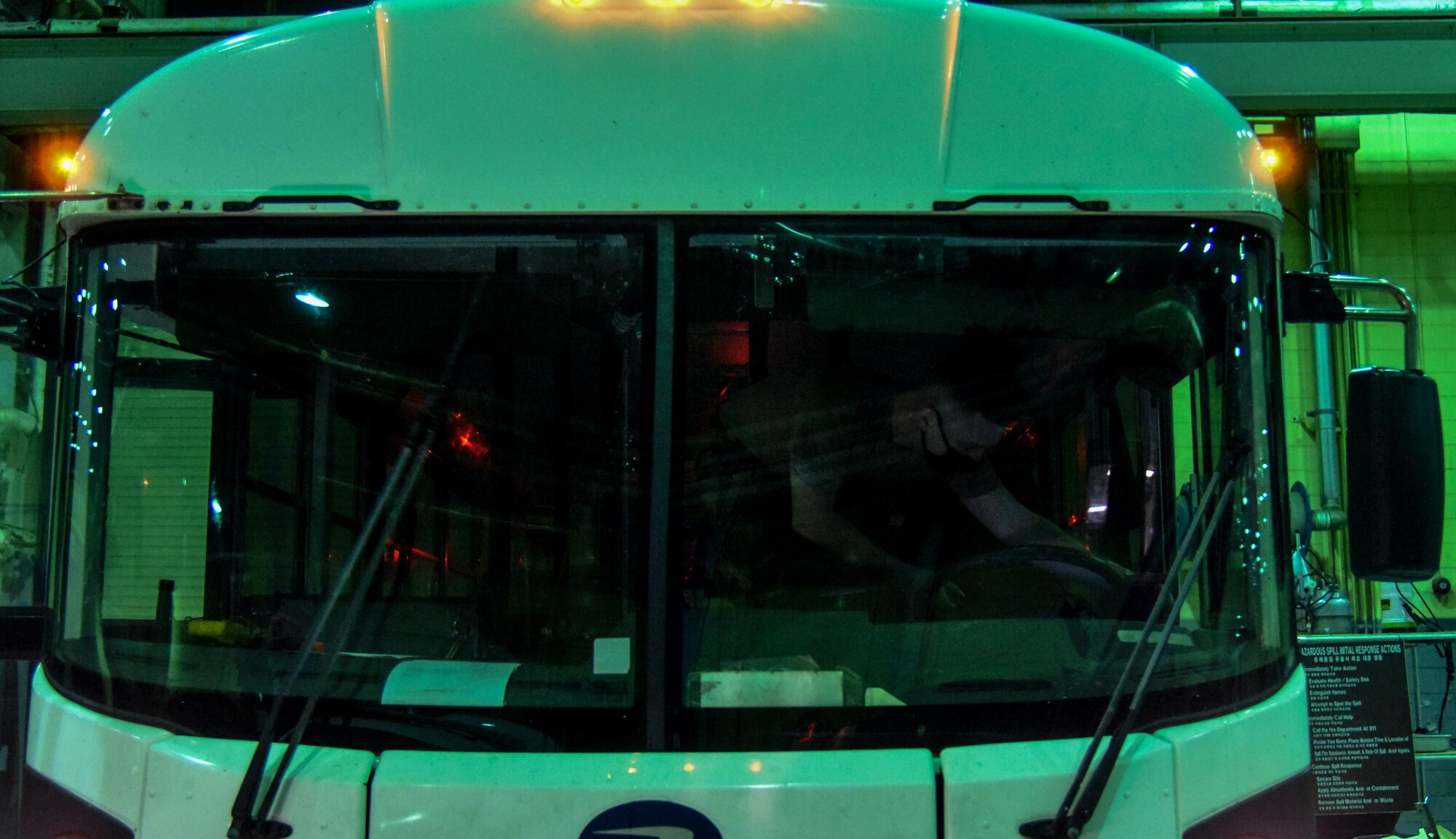 Staff Sgt. Ricky Dupris, 8th Logistics Readiness Squadron vehicle maintenance shop supervisor, inspects the lighting and wiring on a bus at Kunsan Air Base, Republic of Korea, March 23, 2021.  The 8th LRS vehicle maintenance flight maintains and repairs a fleet of more than 500 vehicles, ensuring the Wolf Pack can stay on the move. (U.S. Air Force photo by Tech. Sgt. Kristin S. High)